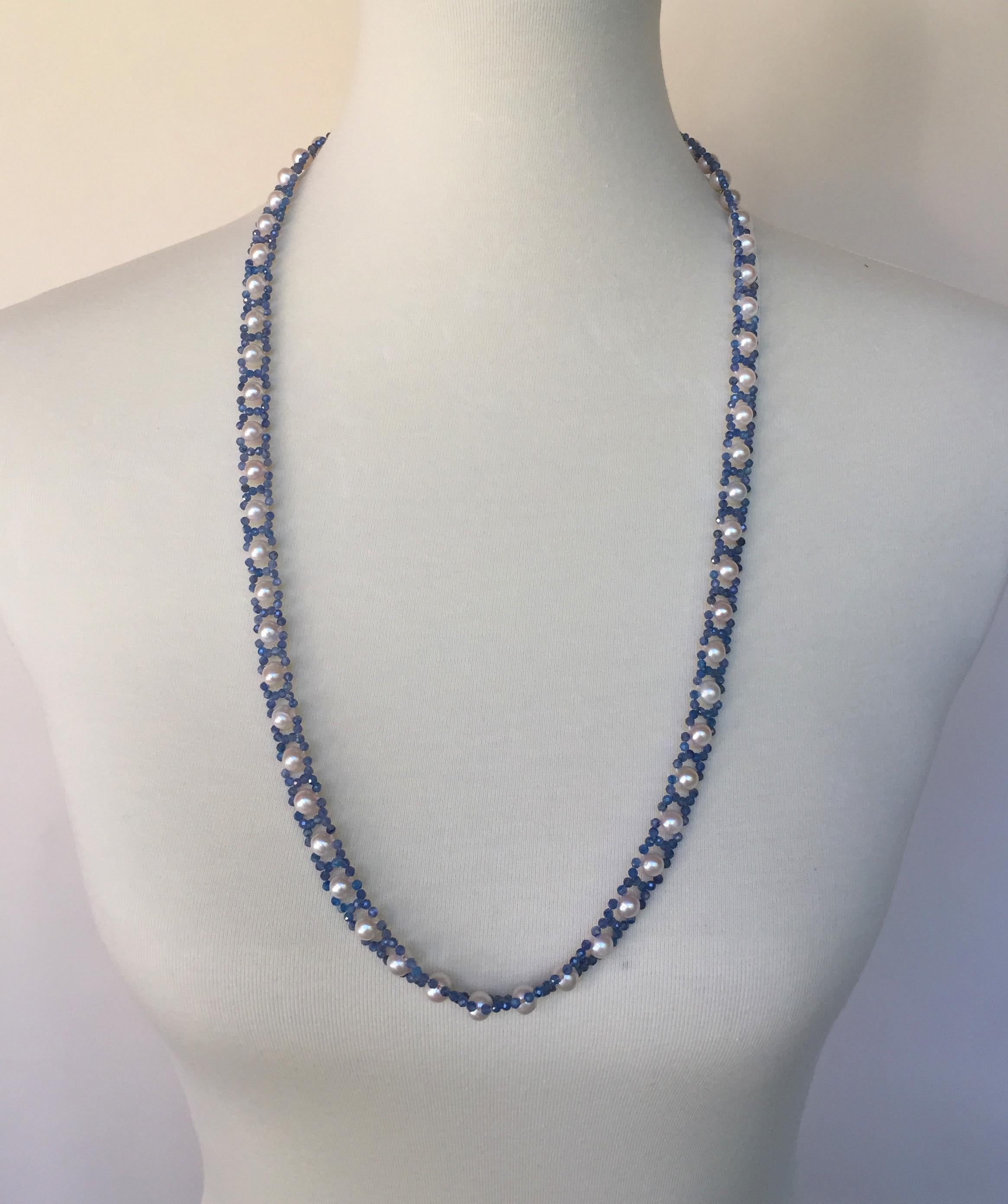 This white pearl and blue kyanite  sautoir necklace has a removable tassel and 14k yellow gold clip. Each white pearl in the sautoir is surrounded by beautiful blue kyanite in a ribbon like design, that is timeless and elegant. The tassel (4.5