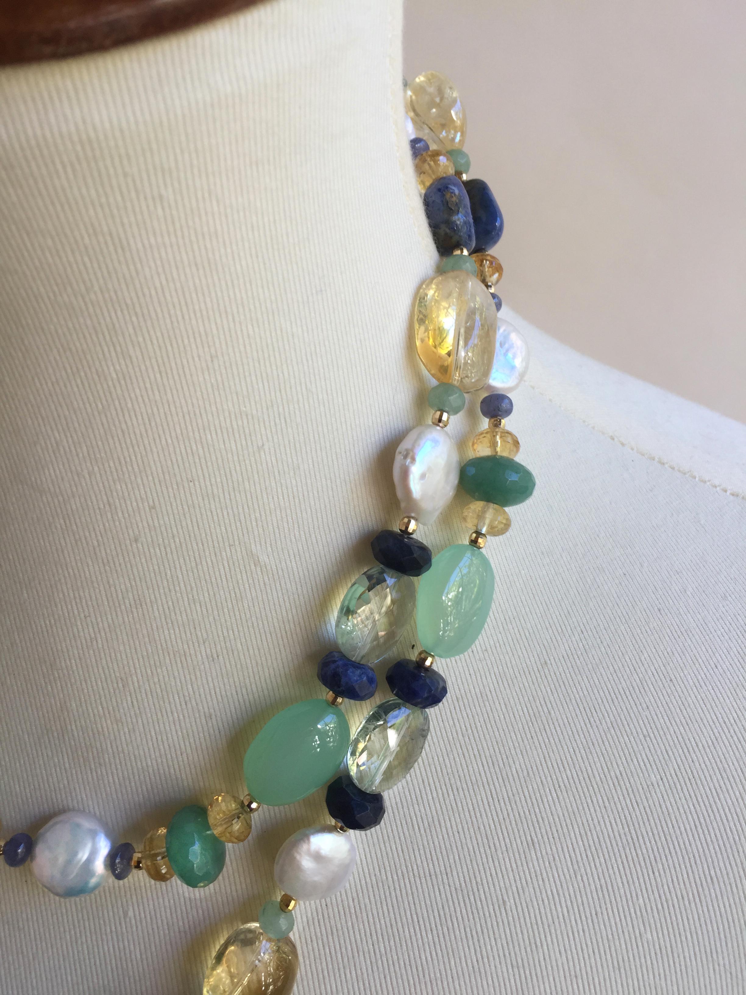 The glowing white pearls come together beautifully with multi color semi precious stone in this necklace and tassel with 14k yellow gold. Composed of faceted citrine, labordite, tanzanite, lapis lazuli, green agate, apatite, and 14k yellow gold