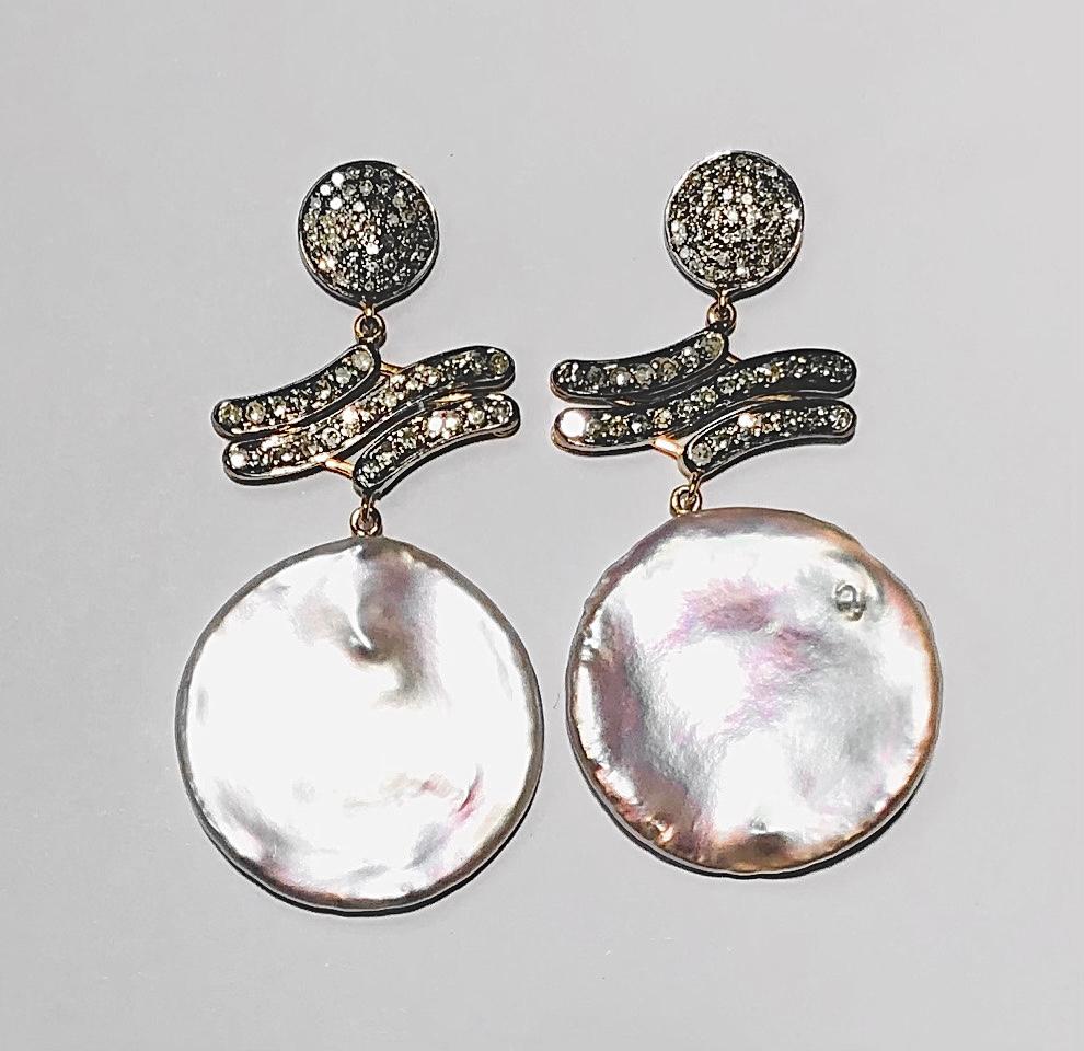 Description
Striking and unique, these high-luster iridescent White Pearl and pave diamond earrings expand allowing them to be worn in a 2.5 inch (see first image) or 2 inch version (see second image).
Item # E3253

Materials and Weight
Freshwater