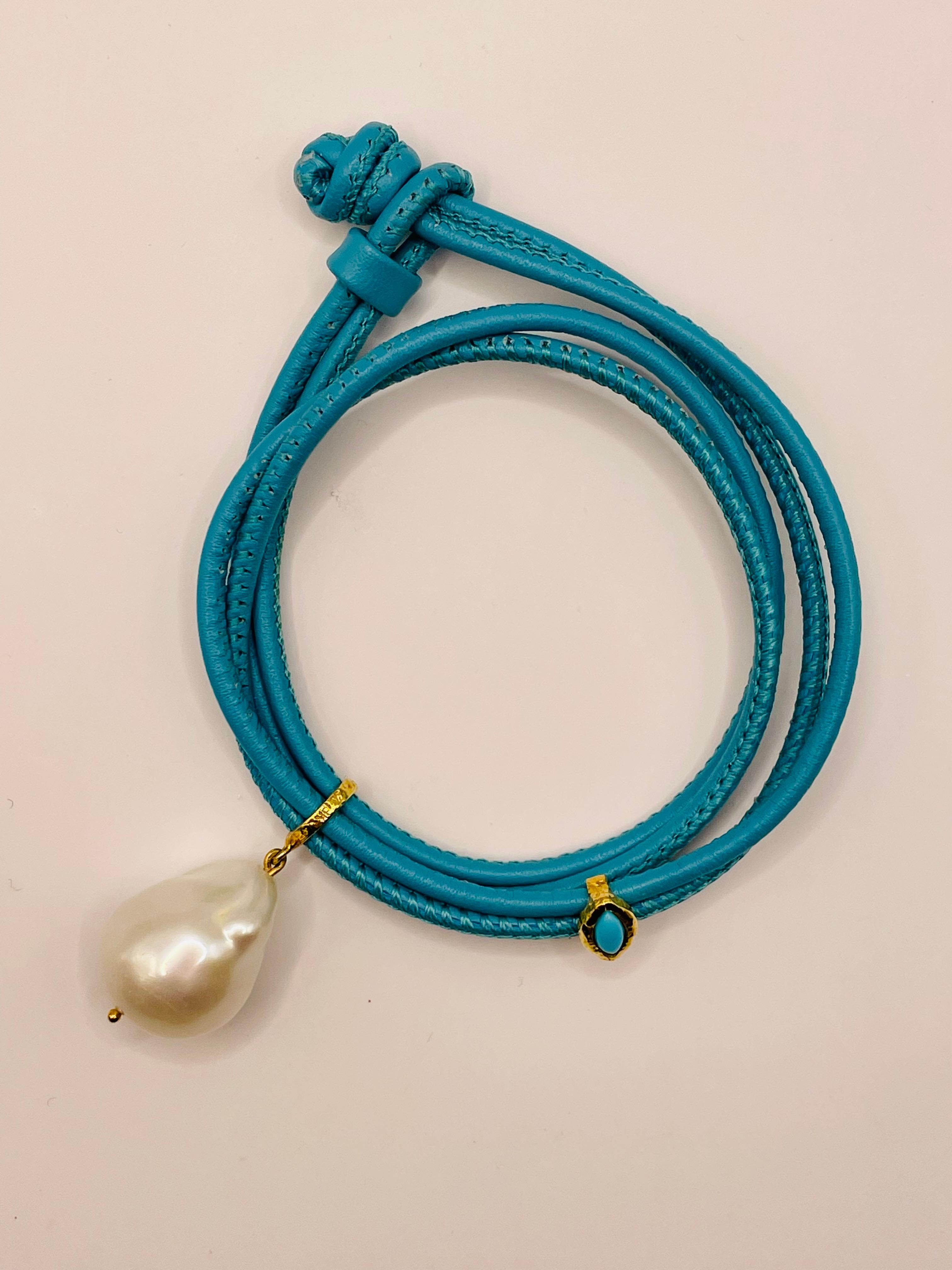 White fresh water baroque  pearl ,turquoise evil eye bracelet .18k gold and Italian turquoise color leather .14 in long ,doubles twice around the wrist  .A bracelet that sets you a part!
