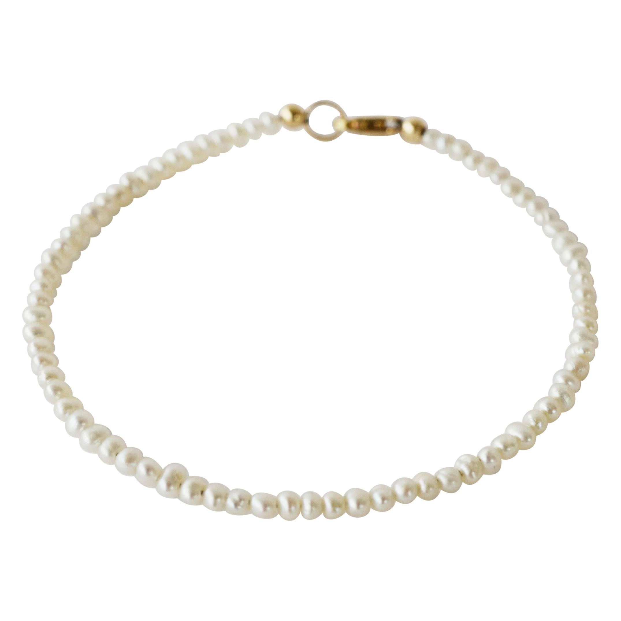 Bracelet perles blanches en vente