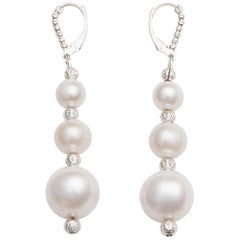 White Pearl Drop Earrings in a Three-Tiered Design
