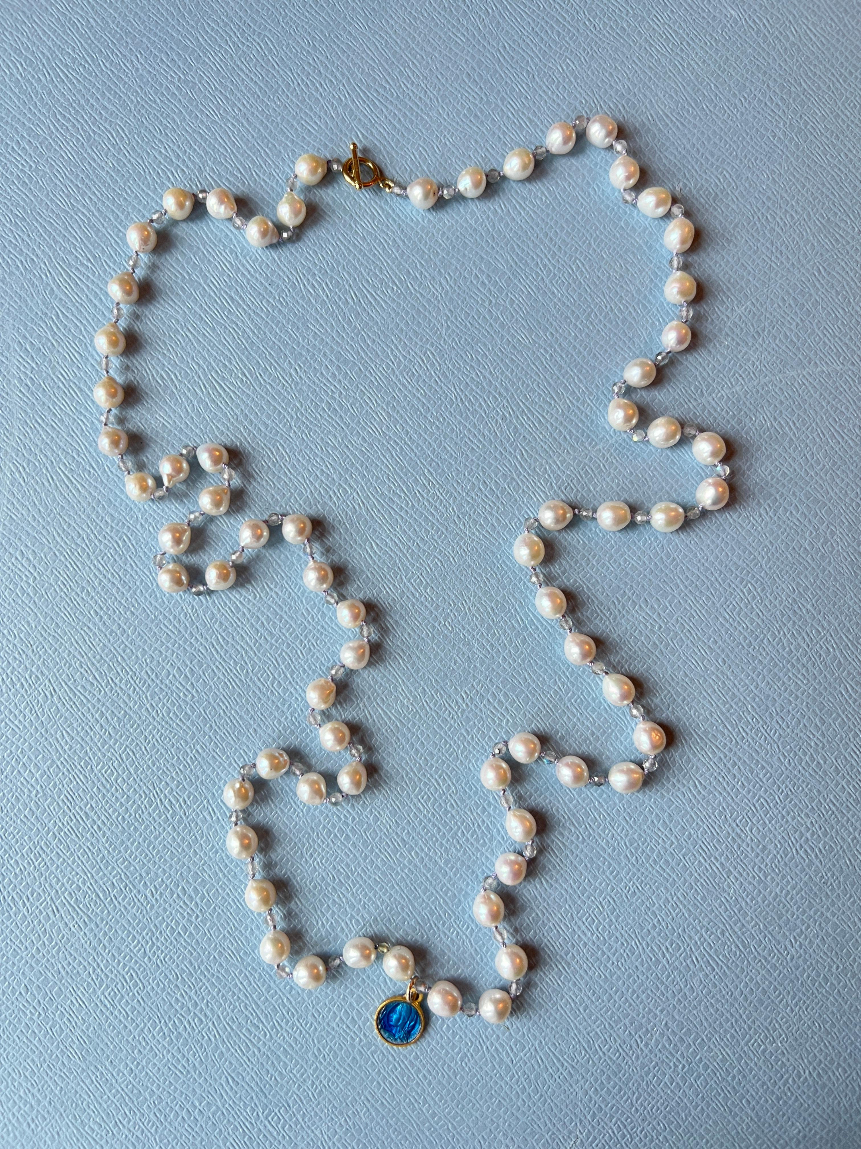 White Pearl labradorite Long Bead Necklace with a french blue enamel vintage littel saint medal
Gold Filled Clasp 

Length 35 inches, 88 cm

White pearls are known for their calming effects, offering peace to those who wear them. They promote