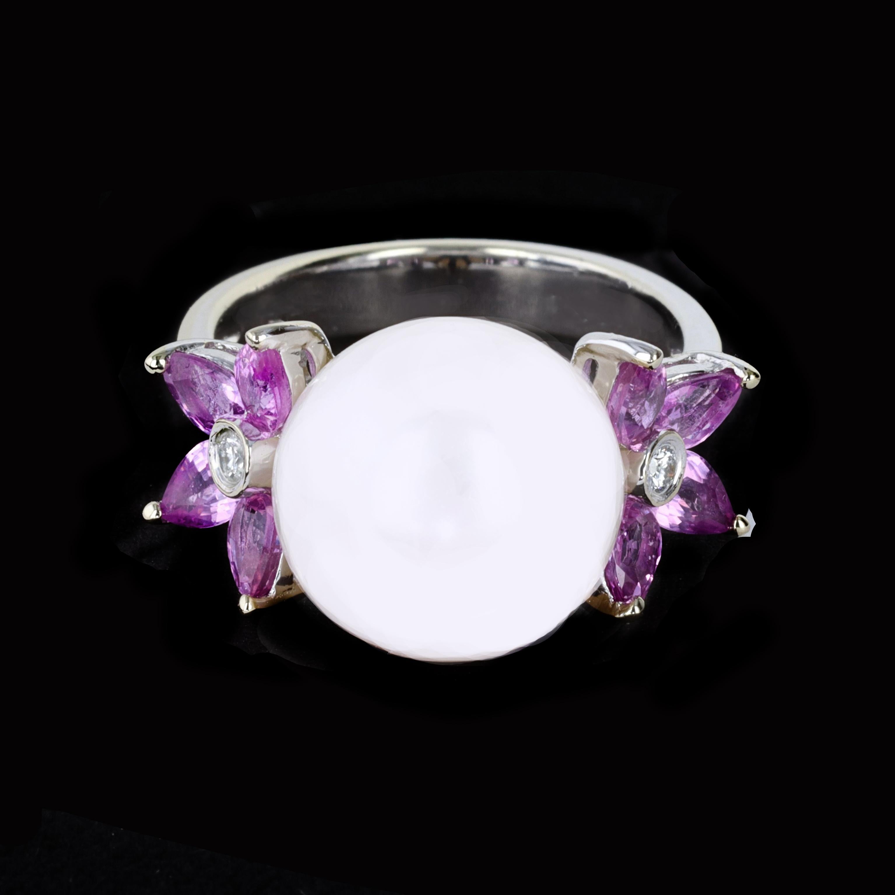 Radiate romance with the perfect combination of vibrant marquise cut pink sapphires and a satiny white pearl in this 18K white gold ring. The ring is centered with one lovely white pearl framed by marquise cut pink sapphires that weigh approximately