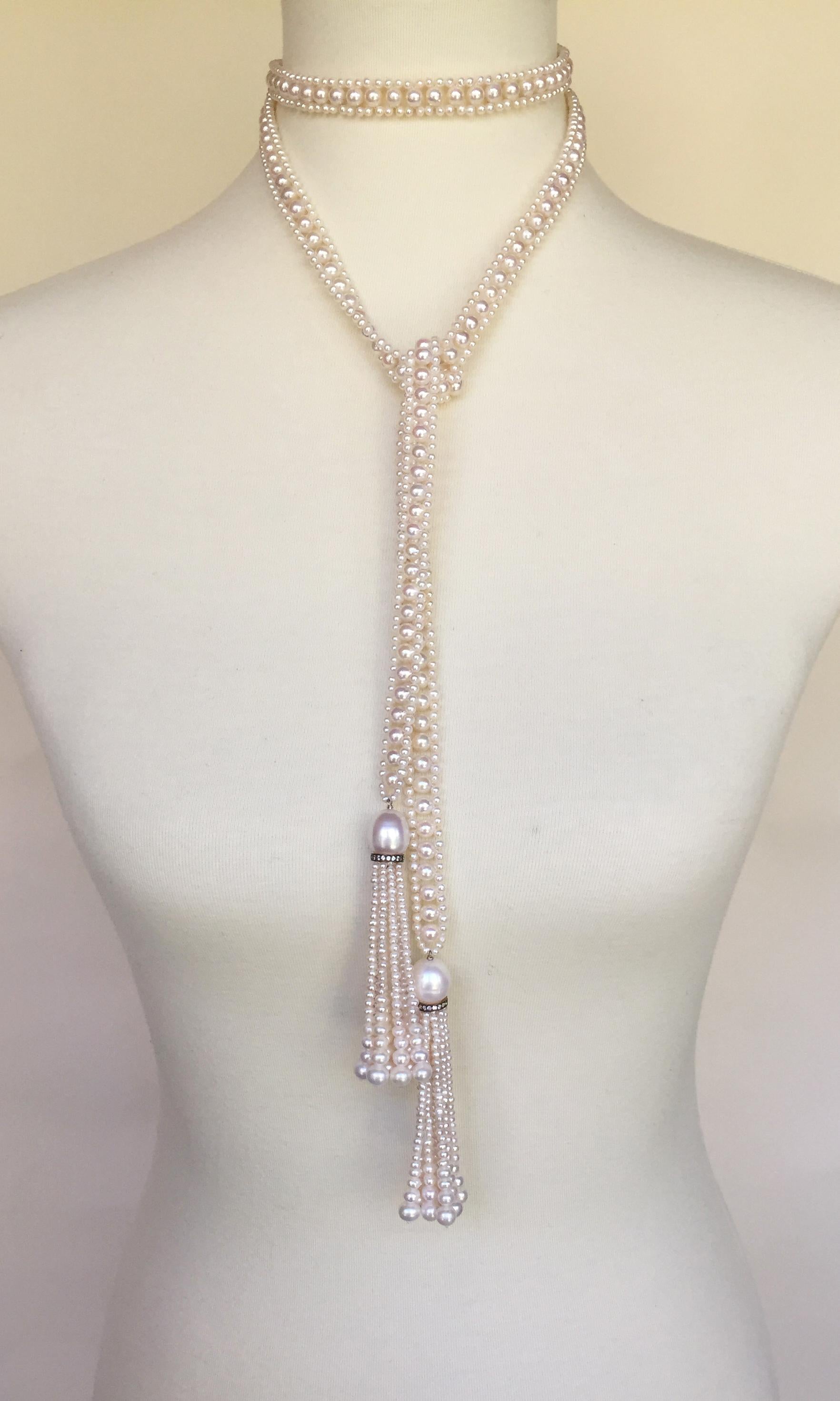 This white pearl rope sautoir necklace with white pearl and diamond tassels is the essence of classic elegance. Handcrafted by Marina J. each pearl was chosen for its beautiful shape and glowing white color. The rope-like design is graceful and
