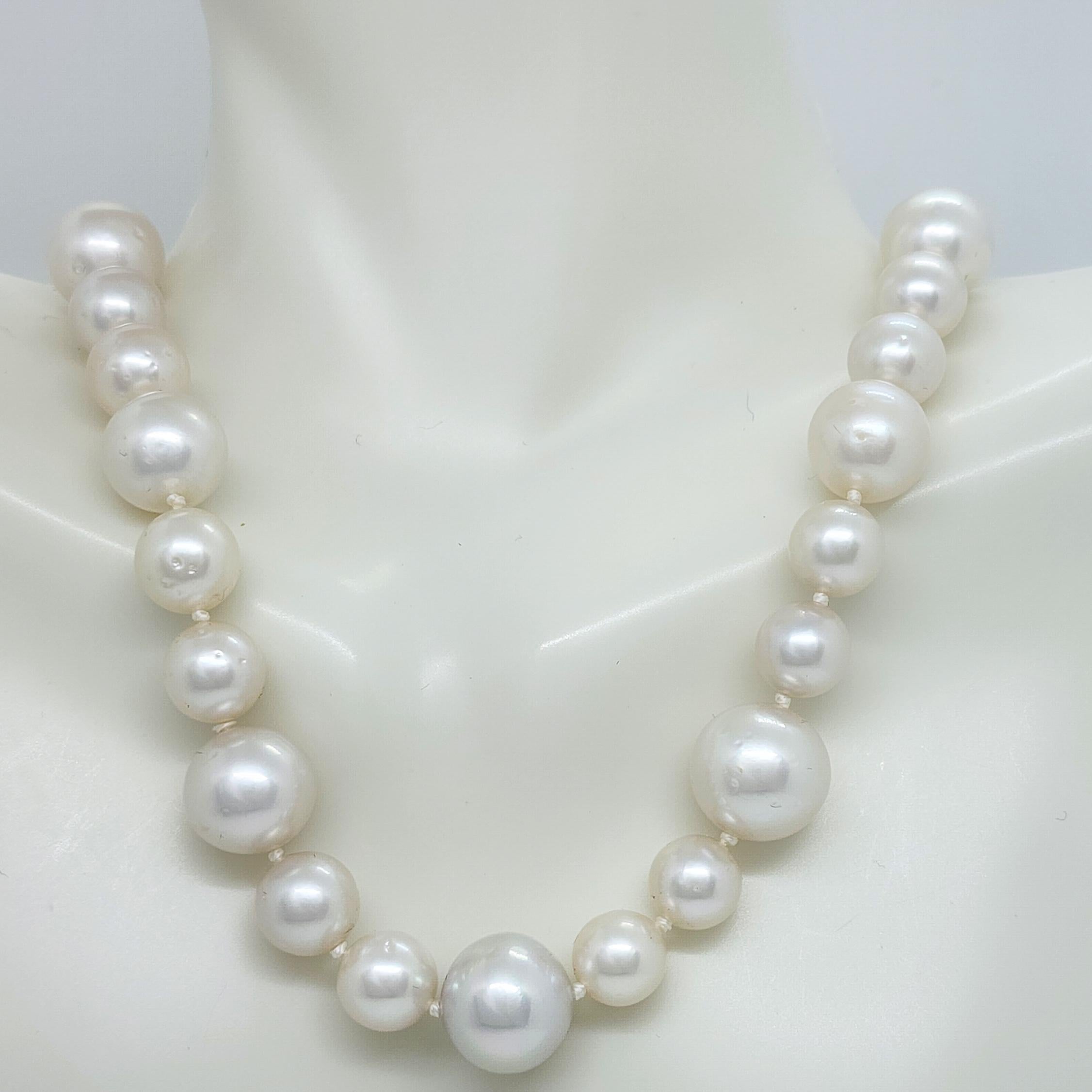 Beautiful white pearl rounds 8-12 mm with a handmade 14k yellow gold toggle clasp.  Length is 17