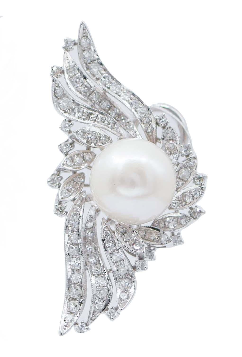 SHIPPING POLICY: 
No additional costs will be added to this order. 
Shipping costs will be totally covered by the seller (customs duties included).

Elegant retrò earrings in 14 kt white gold structure mounted with a central pearl surrounded by