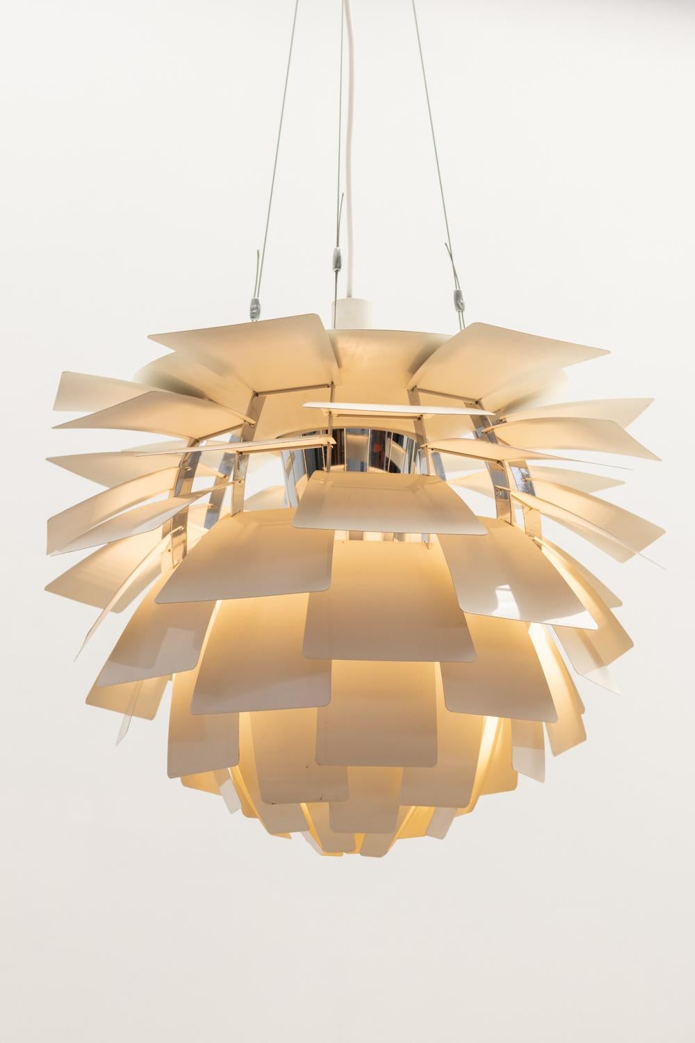 Original Poul Henningsen 'PH Artichoke'  steel chandelier crafted for Louis Poulsen. 
This masterpiece embodies both elegance and innovation, a true testament to Henningsen's visionary design philosophy. 
Meticulously constructed from high-quality