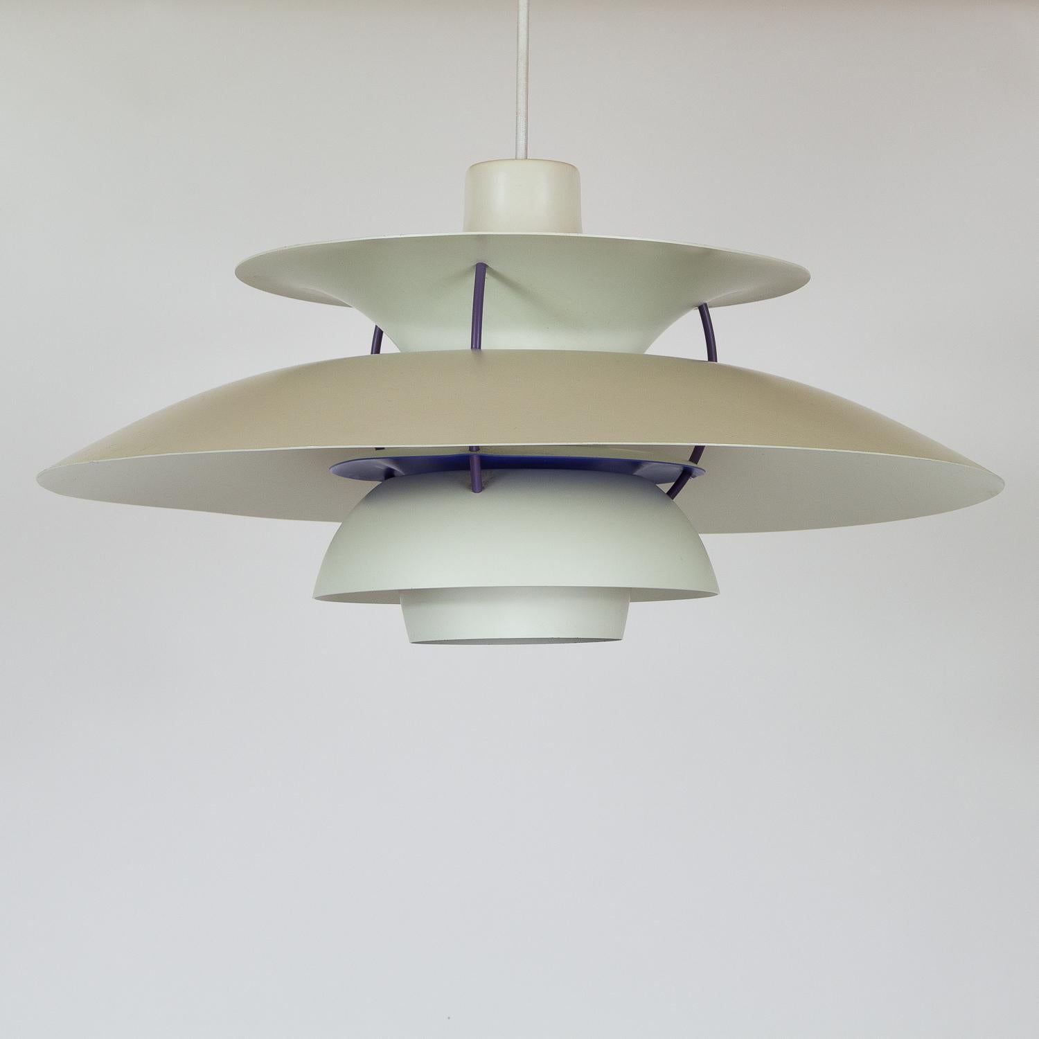 Early example white PH5 ceiling light designed by Poul Henningsen for Louis Poulsen. Designed in 1958 the PH5 is one of the most iconic Danish pendants. The layered shades have been designed to hide the bulb and prevent glare and the interior is red