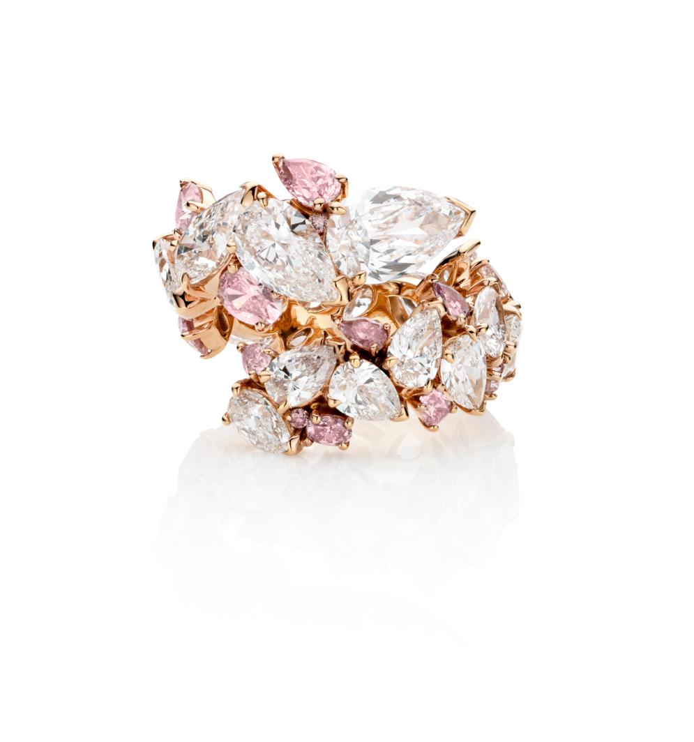 A White & Pink Diamond Ring Set in 18K Rose Gold.

A glorious contemporary mix of some of the most beautiful diamonds have been collated into this eclectic and fun white and pink diamond ring.

35 diamonds 10.15 carats