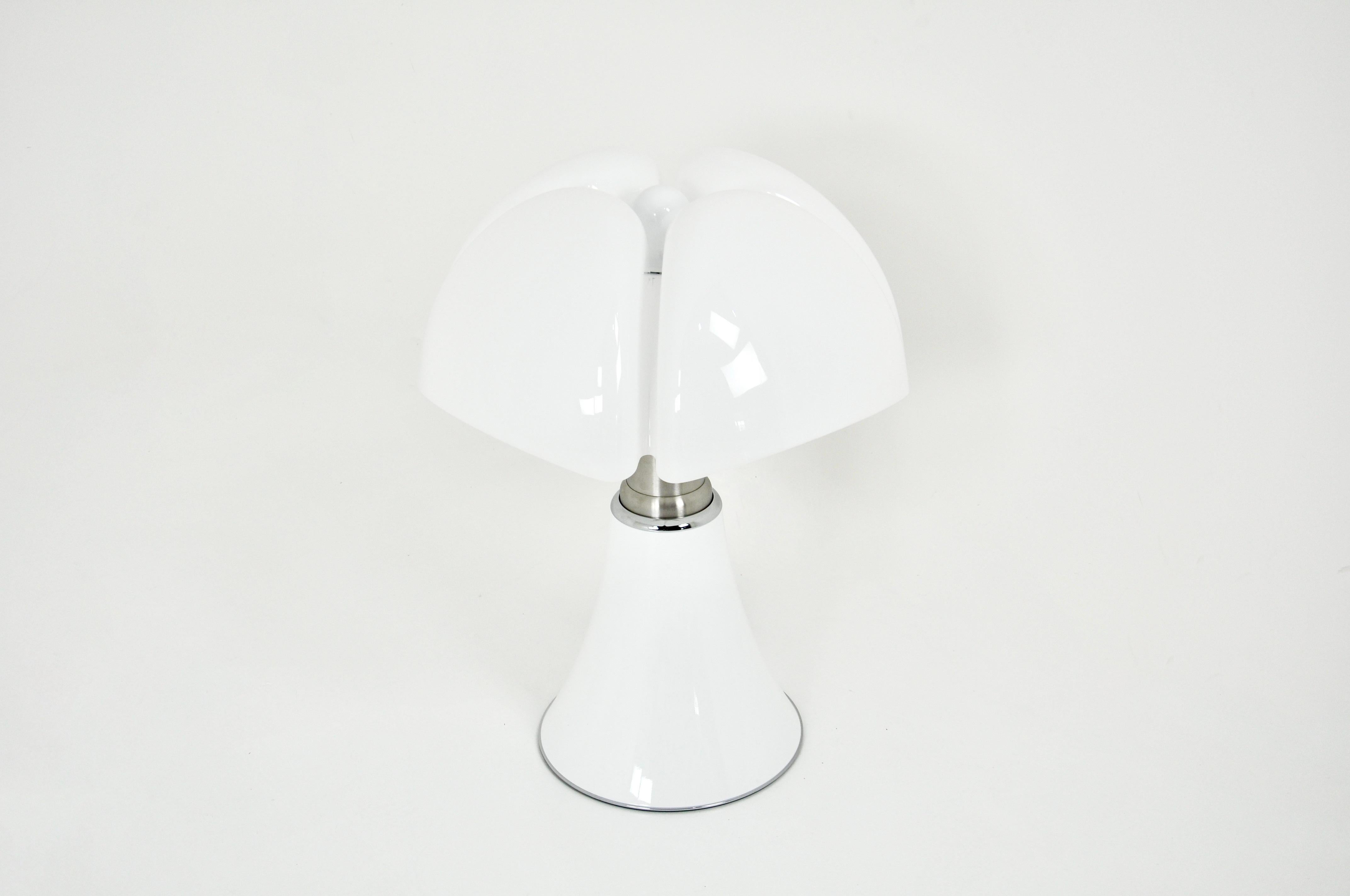 White lamp in metal and plastic by Gae Aulenti. Adjustable in height min: 70cm max: 90cm 
Stamped under the lamp.
