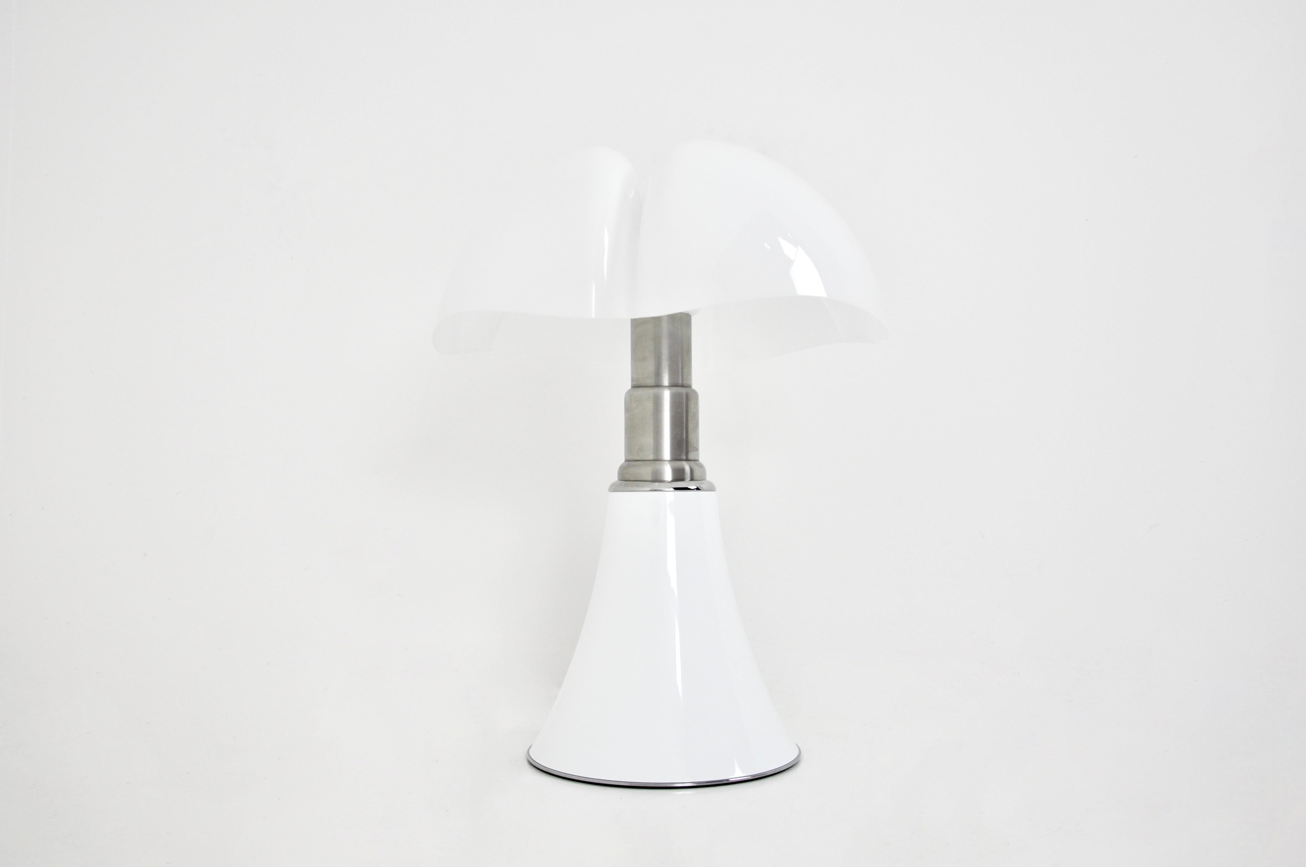 White lamp in metal and plastic by Gae Aulenti. Adjustable in height min: 70cm max: 90cm 
Stamped Martinelli Luce, Gae Aulenti.
FOR SHIPPING, REQUEST US FOR RECEIVE THE BEST PRICE

