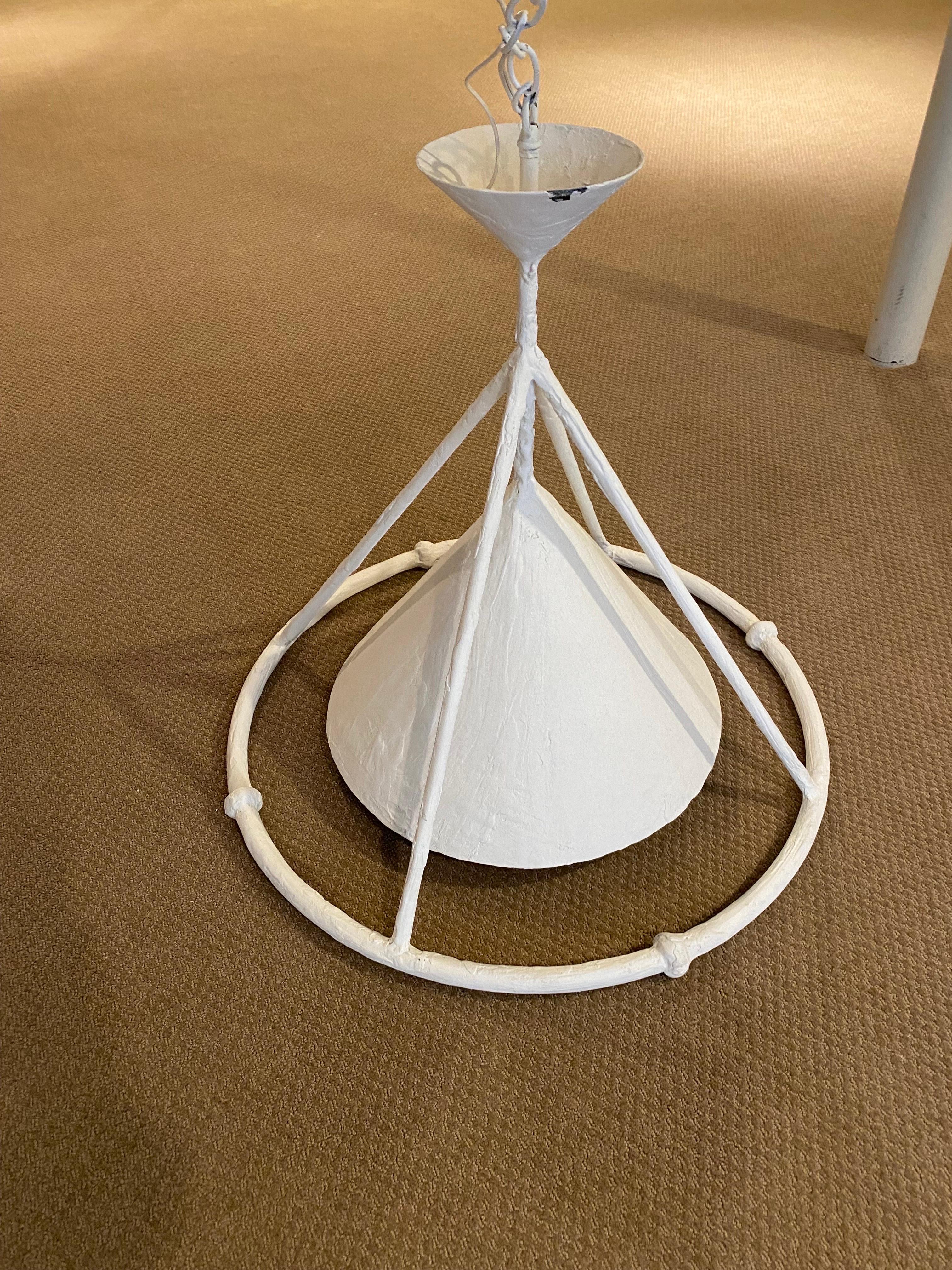 White Plaster Custom Hanging Lighting Fixture by Paul Ferrante 
A outer metal conical structure with four arms rising to an inverse conical top, with loop and white chain. Inside this frame is a solid conical metal shade housing a single edison base