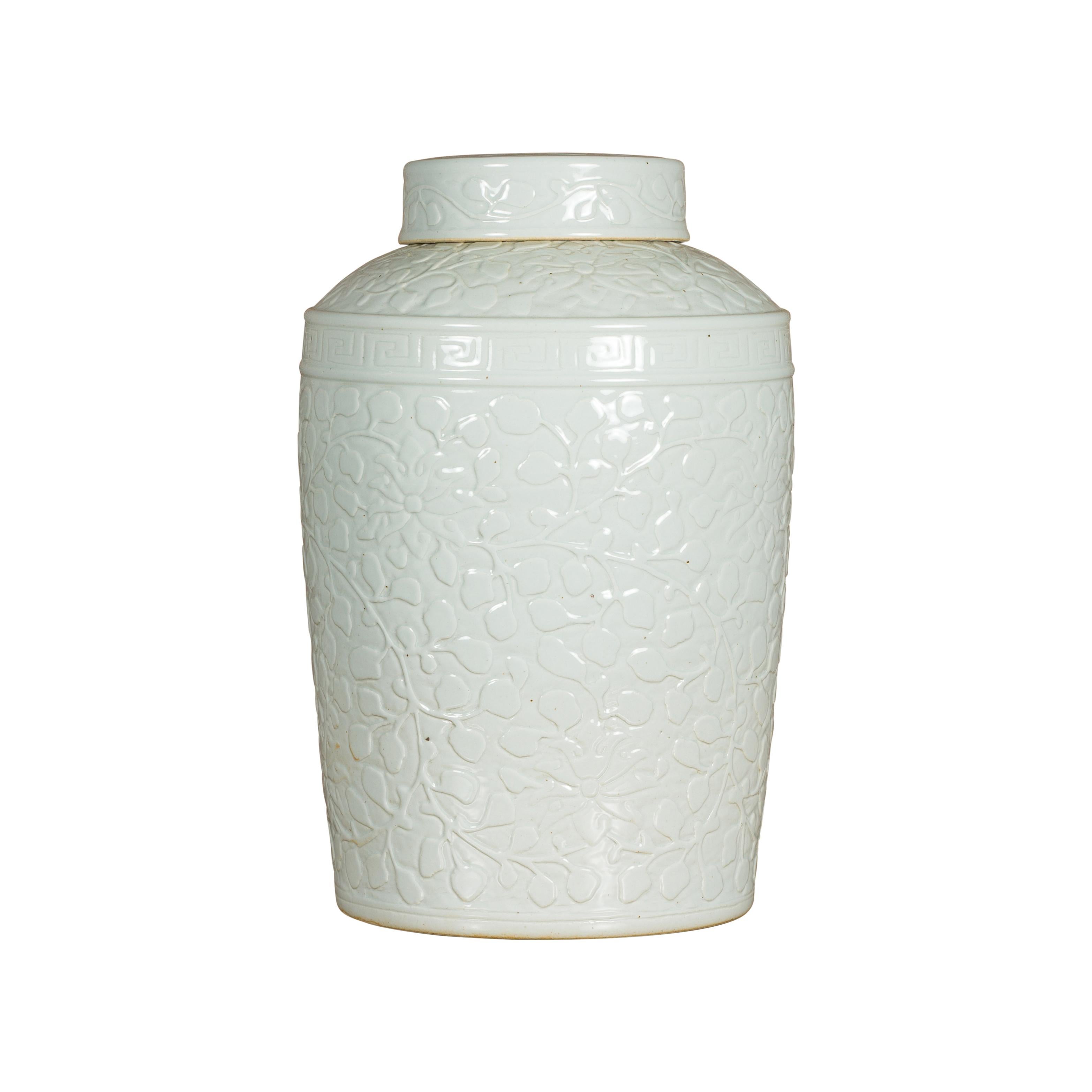 White Porcelain Asian Lidded Jar with Scrolling Foliage Motifs For Sale 6