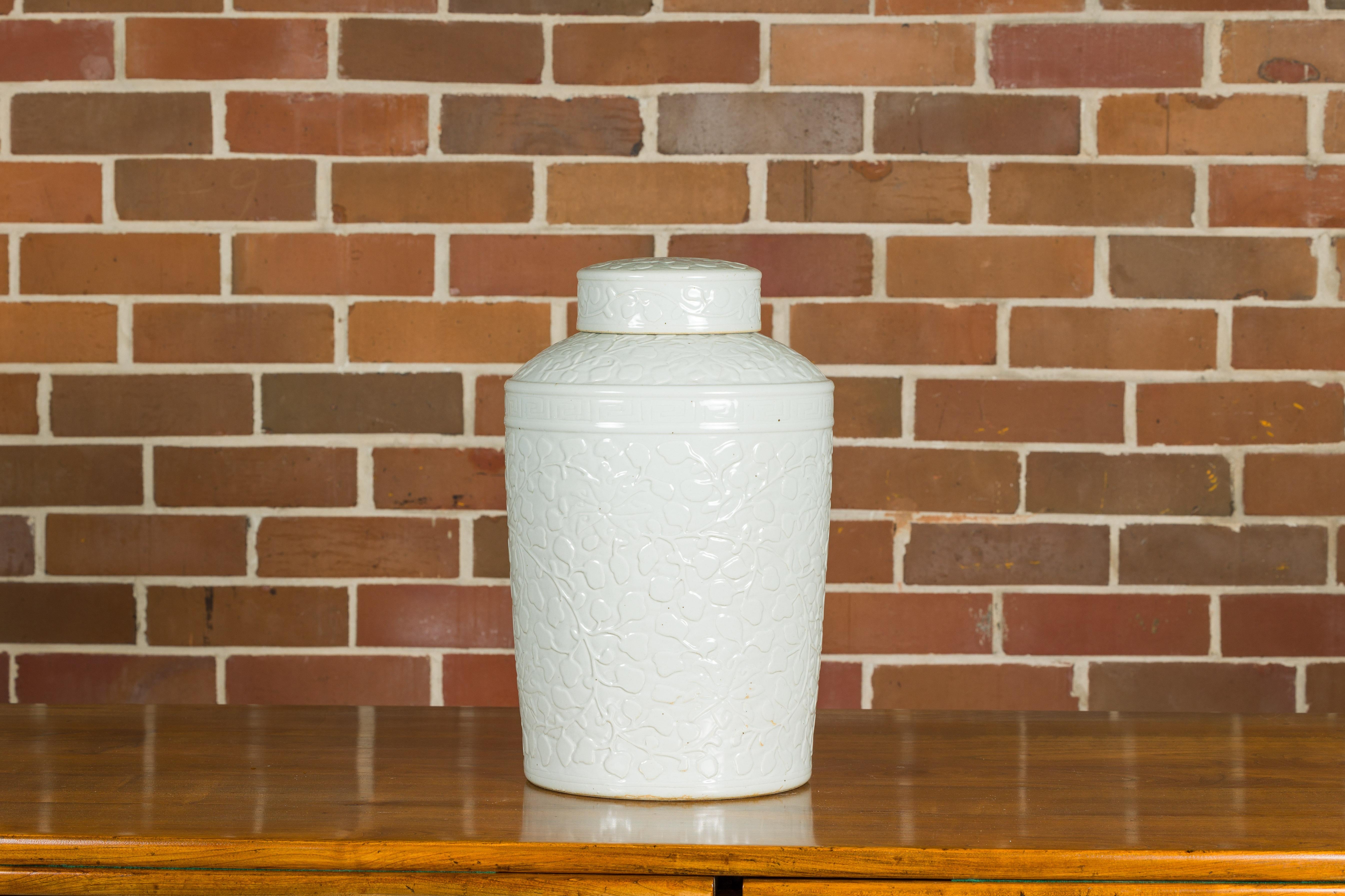 20th Century White Porcelain Asian Lidded Jar with Scrolling Foliage Motifs For Sale
