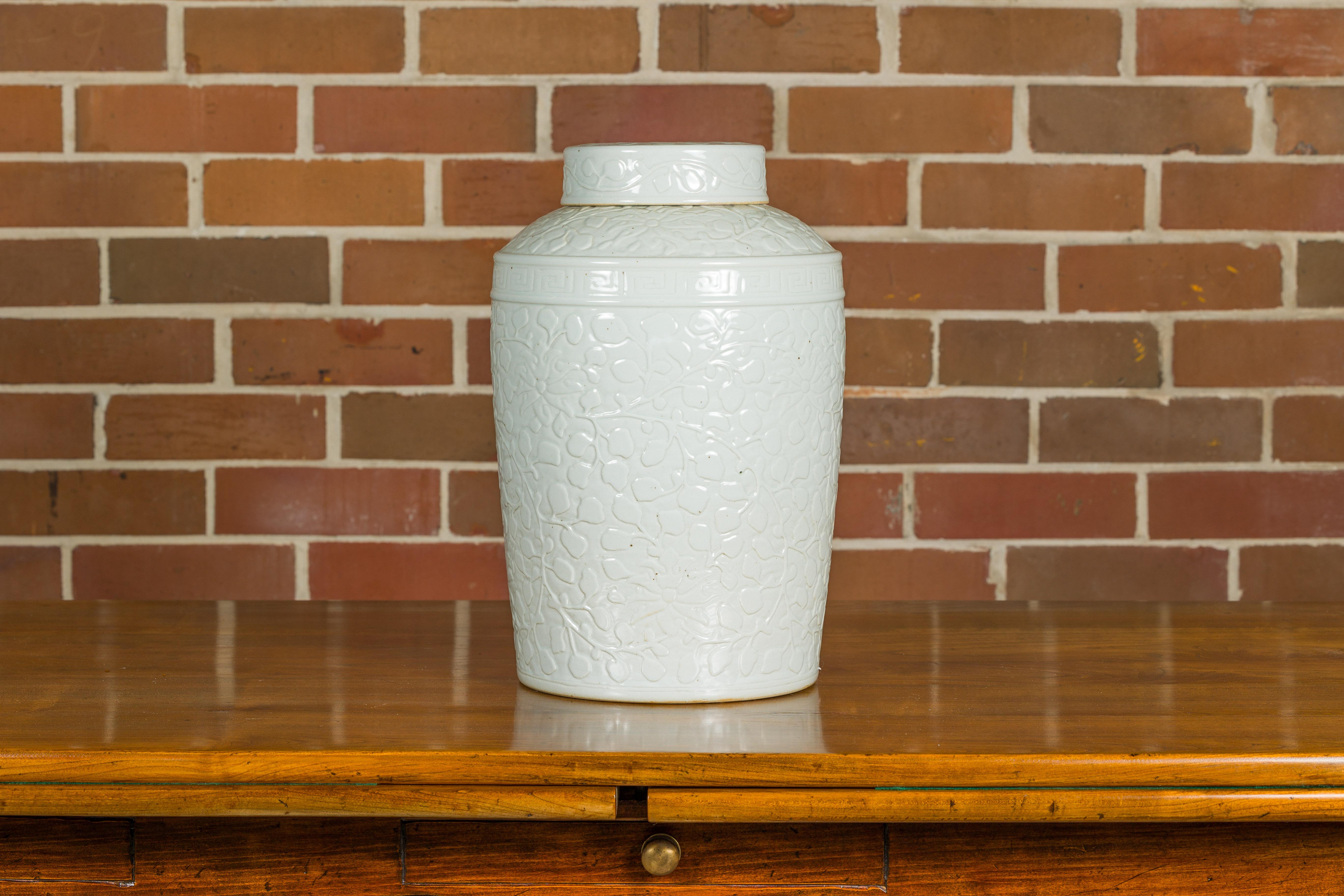 White Porcelain Asian Lidded Jar with Scrolling Foliage Motifs For Sale 1