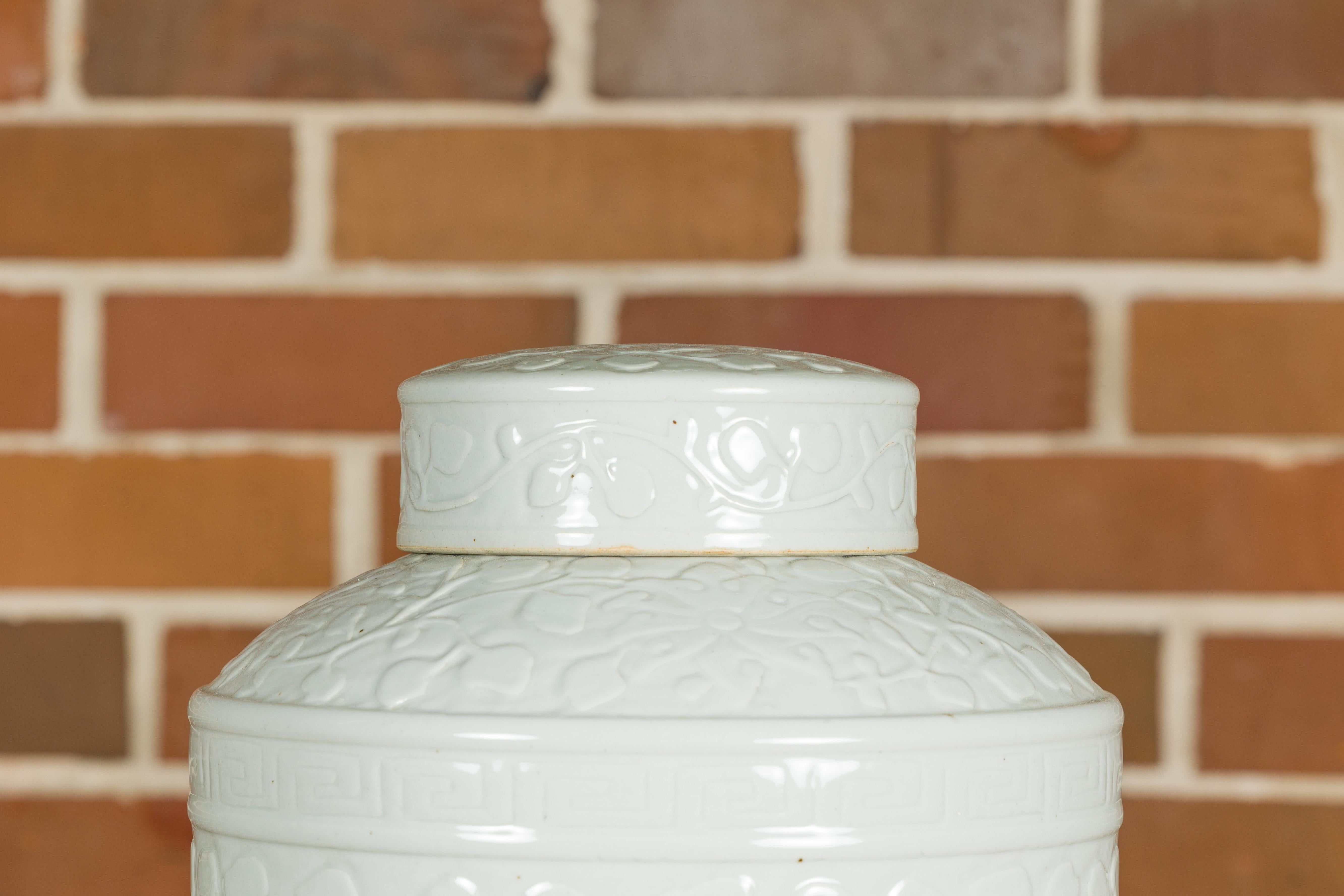 White Porcelain Asian Lidded Jar with Scrolling Foliage Motifs For Sale 4