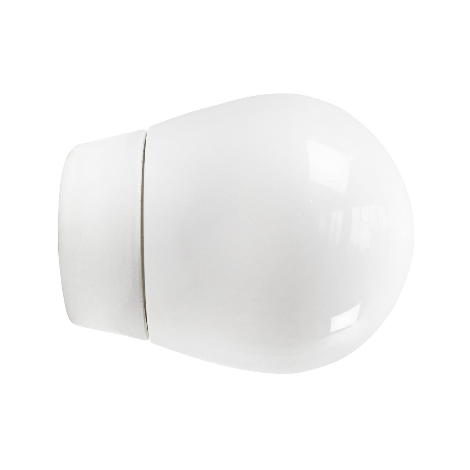 Porcelain wall lamp / scone by Lindner no. 6000
Designed by Wilhelm Wagenfeld
White porcelain, white opaline glass.

2 conductors, no ground.
Measures: Diameter foot 85 mm
Suitable for 110 volt USA
New wiring is UL listed (110 volt) or CE