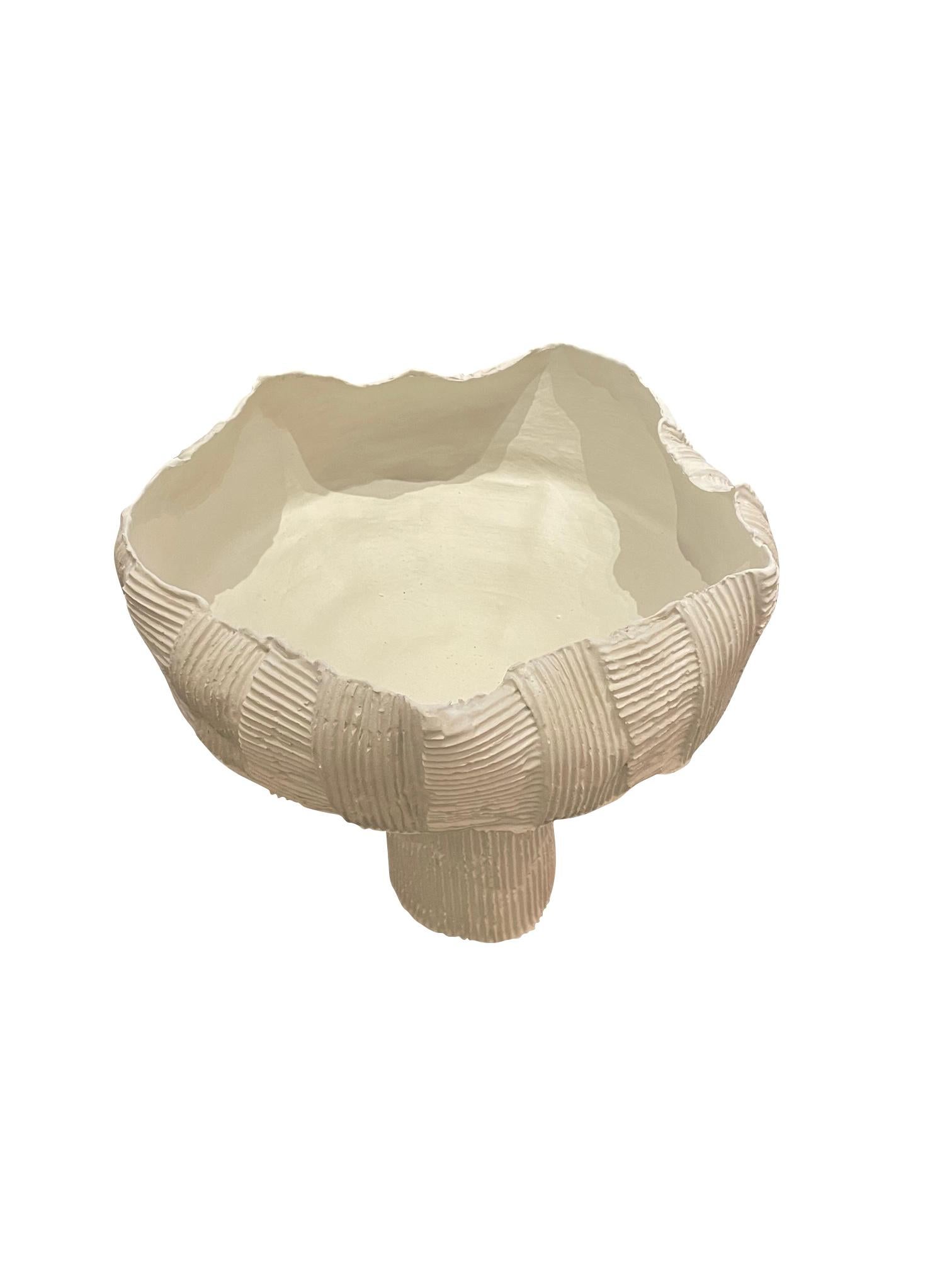 Contemporary Italian white porcelain footed bowl with  all around corrugated cardboard design.
Handmade