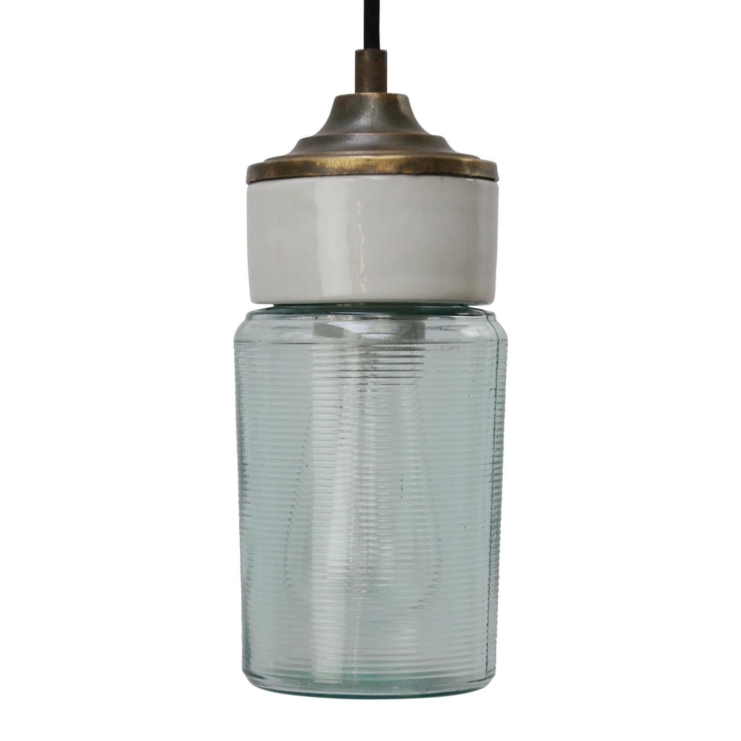 Porcelain industrial hanging lamp.
White porcelain, brass and clear striped glass.
2 conductors, no ground.

Weight: 1.50 kg / 3.3 lb

Priced per individual item. All lamps have been made suitable by international standards for incandescent