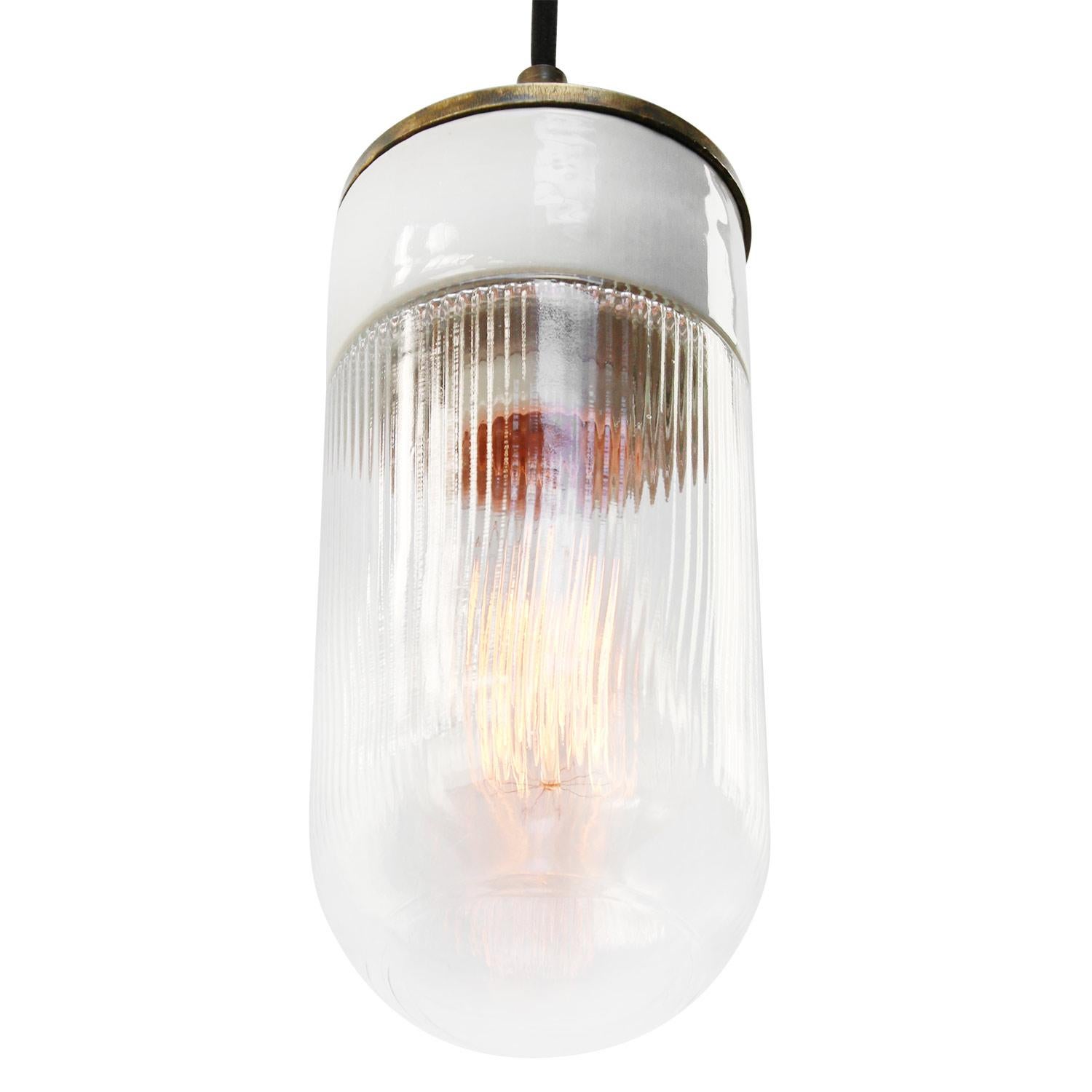 Porcelain Industrial hanging lamp.
White porcelain, brass and clear striped glass.
2 conductors, no ground.

Weight: 2.00 kg / 4.4 lb

Priced per individual item. All lamps have been made suitable by international standards for incandescent