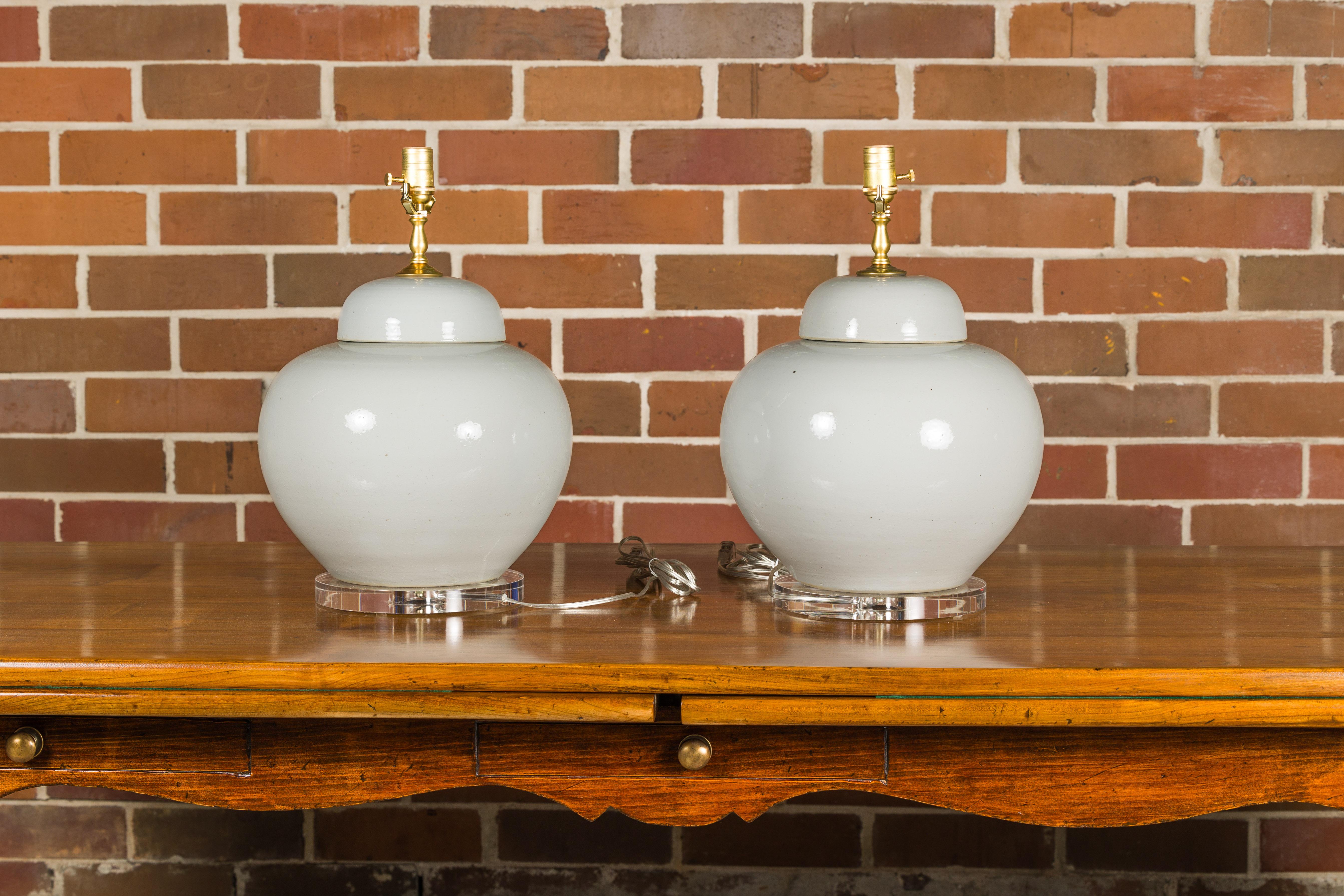 White Porcelain Lidded Urns Made into Wired Table Lamps on Lucite Bases, a Pair For Sale 1