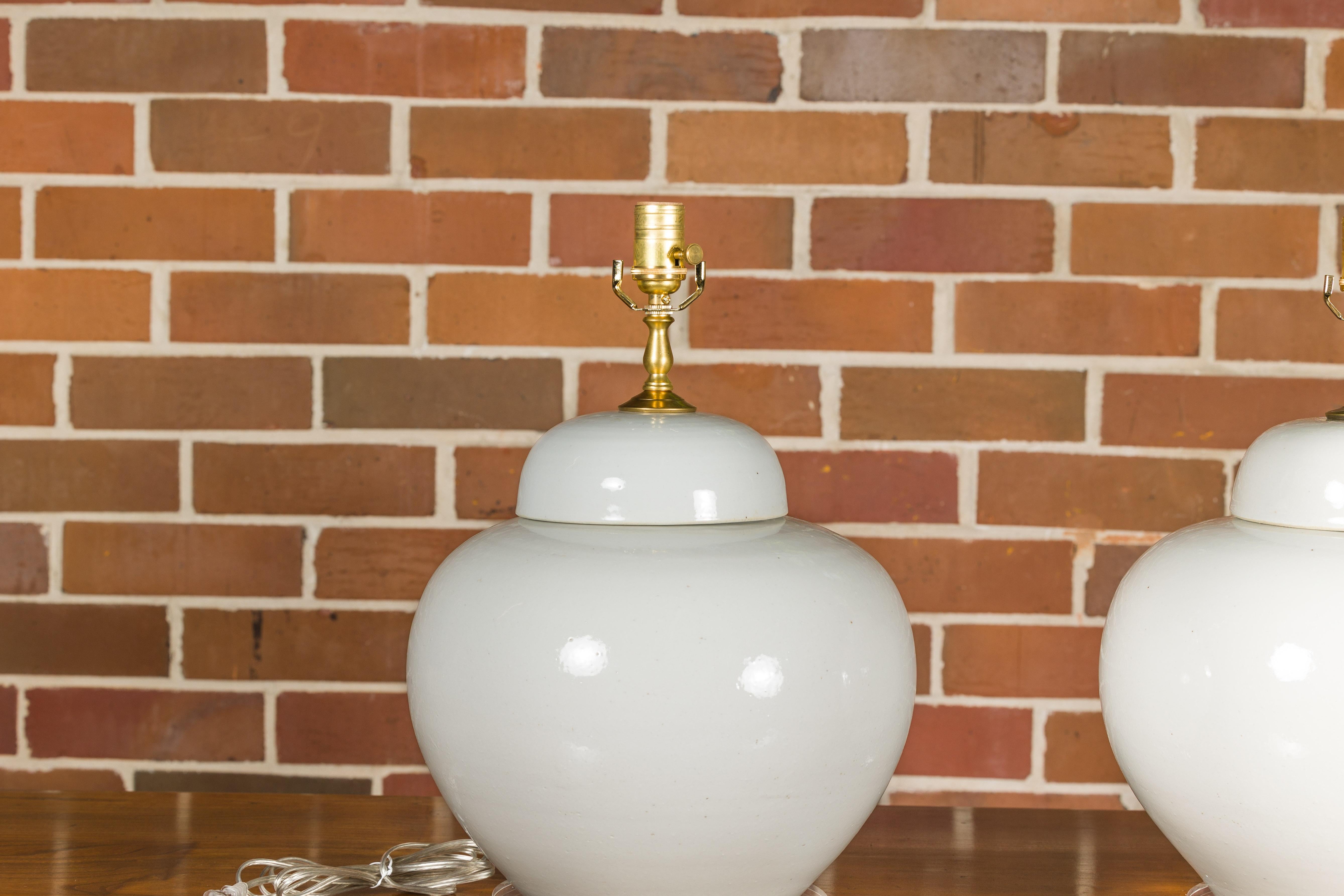 White Porcelain Lidded Urns Made into Wired Table Lamps on Lucite Bases, a Pair For Sale 2