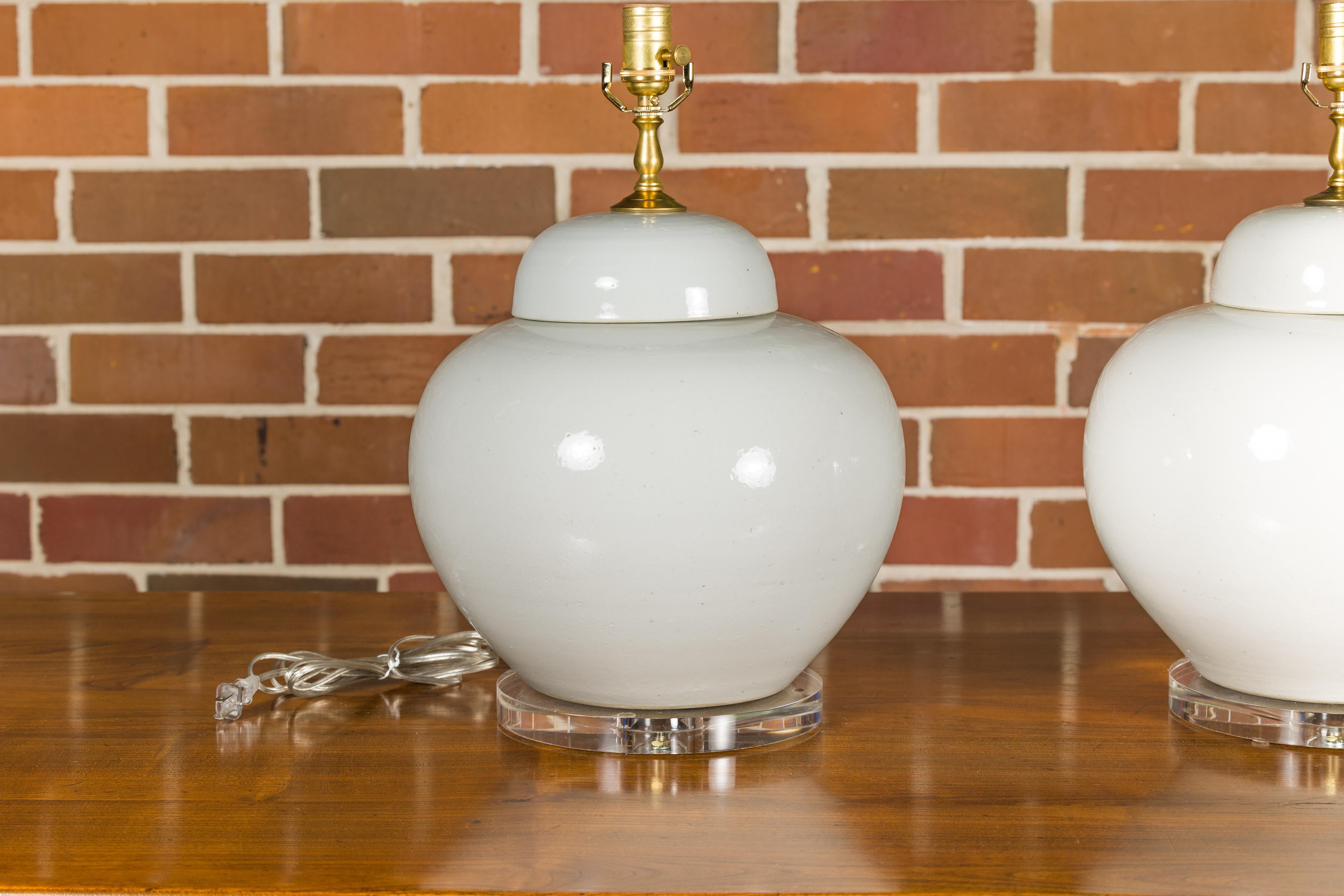 White Porcelain Lidded Urns Made into Wired Table Lamps on Lucite Bases, a Pair For Sale 3