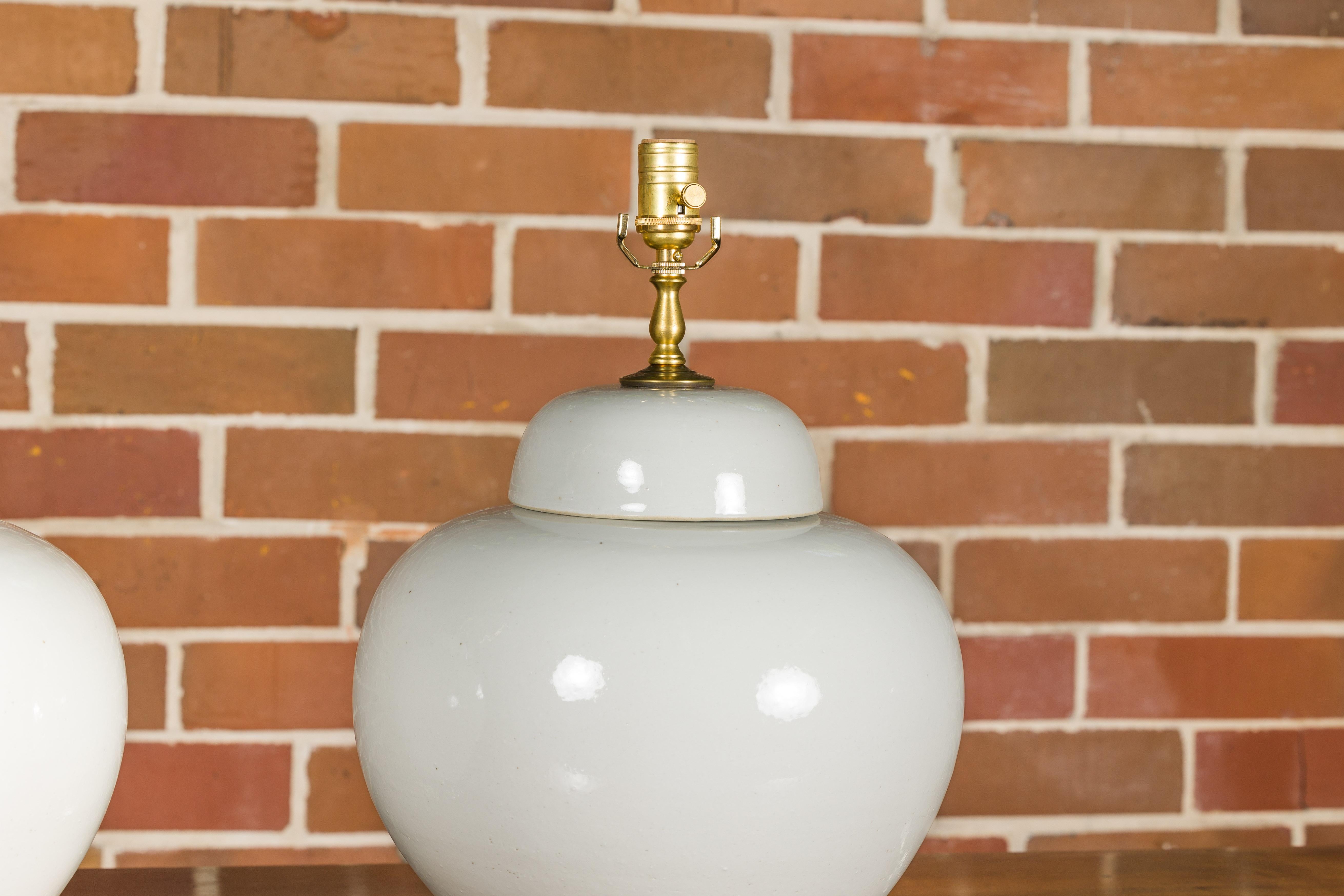 White Porcelain Lidded Urns Made into Wired Table Lamps on Lucite Bases, a Pair For Sale 4