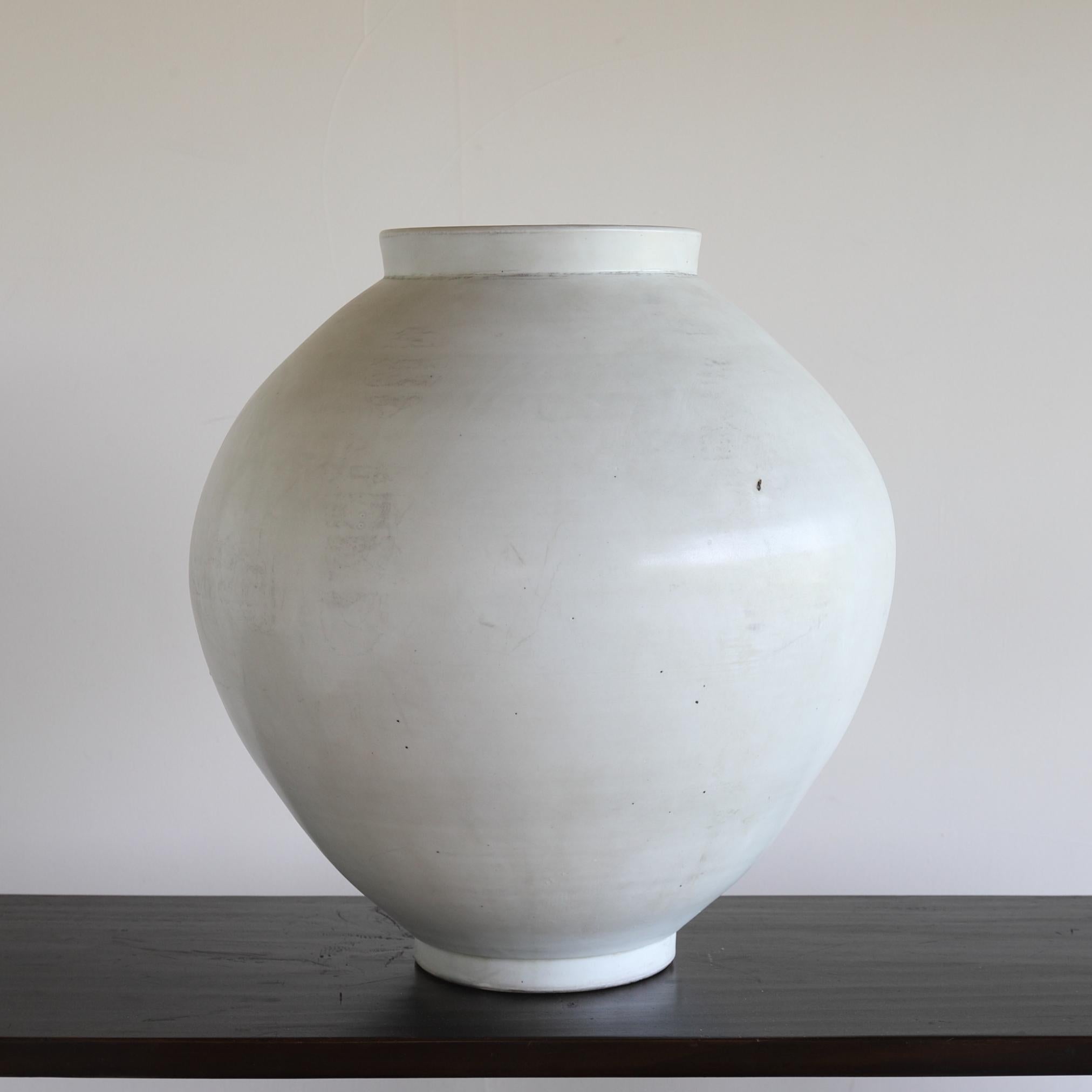 This is a white porcelain jar from the mid-Joseon period, also known as a 