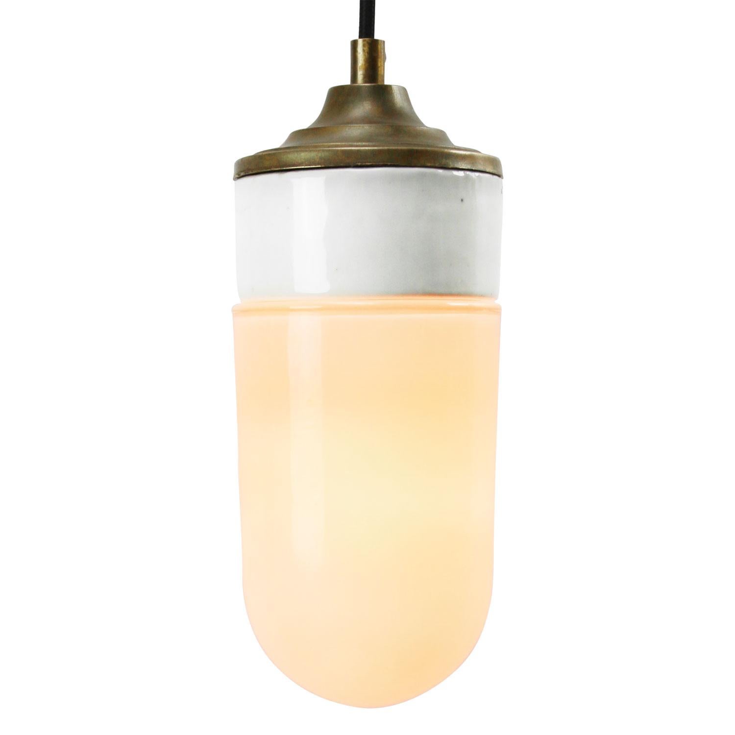 Porcelain industrial hanging lamp.
White porcelain, brass and opaline glass.
2 conductors, no ground.

Weight: 1.20 kg / 2.6 lb

Priced per individual item. All lamps have been made suitable by international standards for incandescent light bulbs,