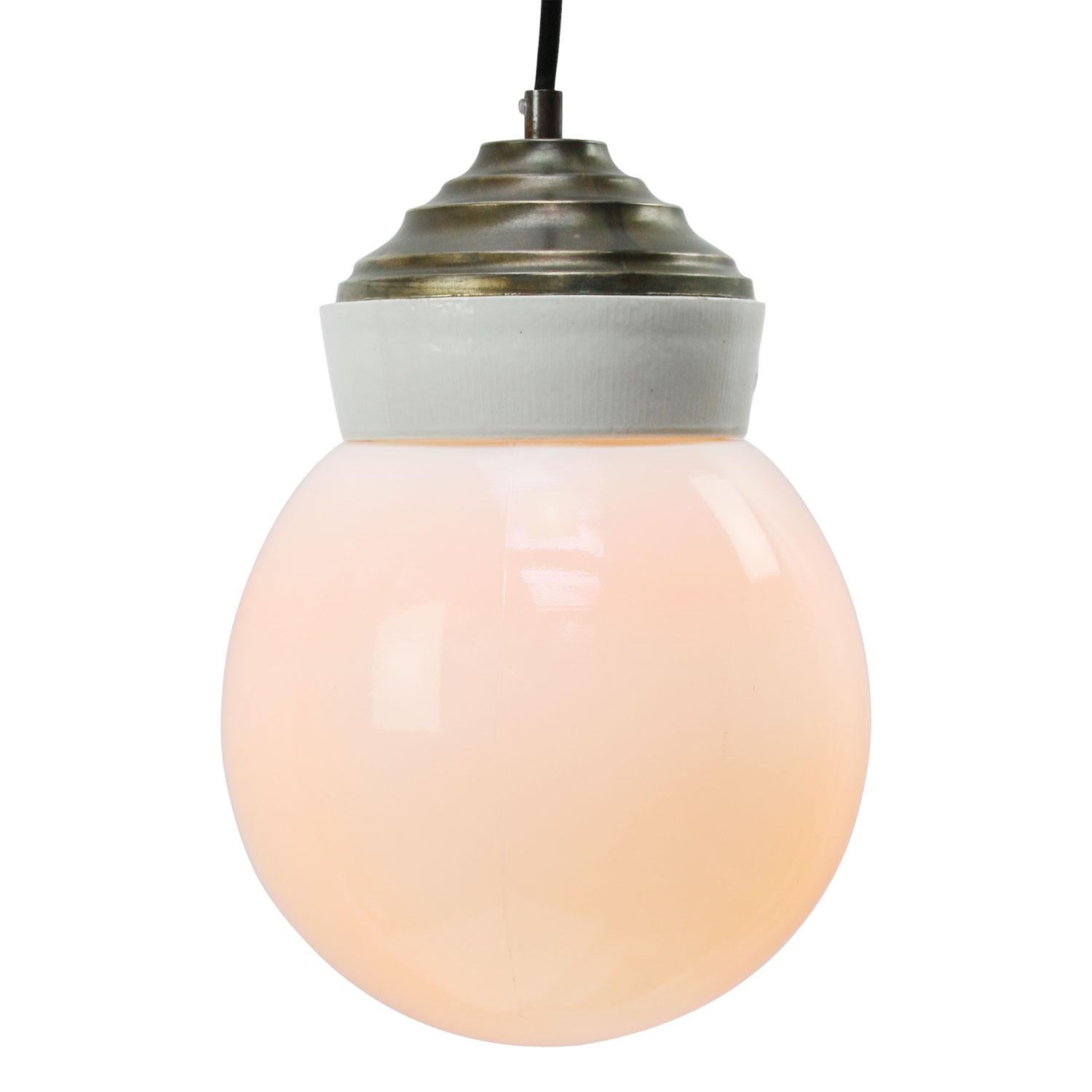 Porcelain industrial hanging lamp.
White porcelain, brass and opaline glass.
2 conductors, no ground.

Weight: 2.40 kg / 5.3 lb

Priced per individual item. All lamps have been made suitable by international standards for incandescent light bulbs,