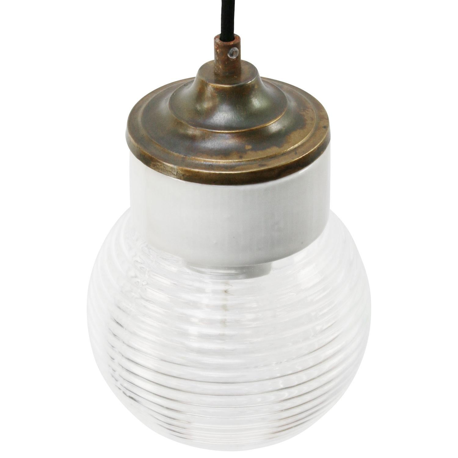 Porcelain Industrial hanging lamp.
White porcelain, brass and clear striped glass.
2 conductors, no ground.

Weight: 1.20 kg / 2.6 lb

Priced per individual item. All lamps have been made suitable by international standards for incandescent