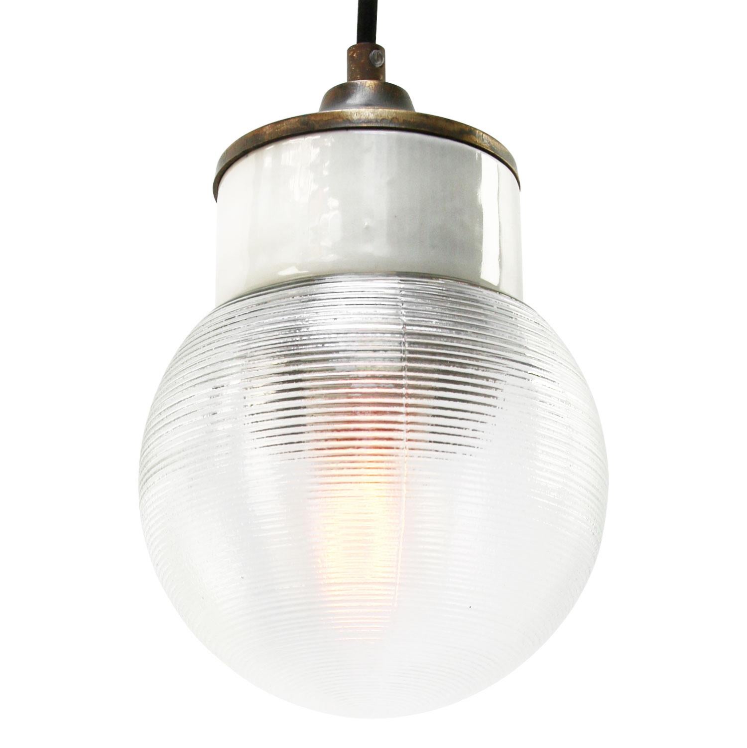 Porcelain industrial hanging lamp.
White porcelain, brass and clear striped glass.
2 conductors, no ground.

Weight: 1.20 kg / 2.6 lb

Priced per individual item. All lamps have been made suitable by international standards for incandescent