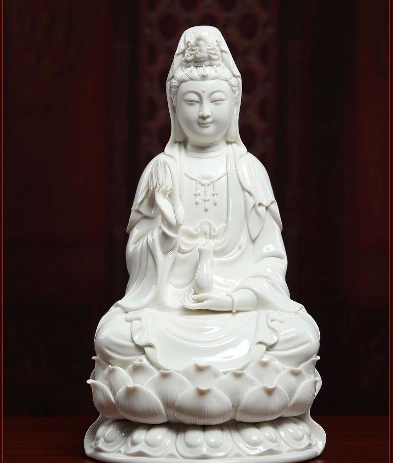 This Vintage White Porcelain Statue gracefully depicts the South Sea Buddha, seated serenely upon a lotus flower, a timeless symbol of purity, enlightenment, and spiritual awakening. Handcrafted with refined detail, the statue embodies the tranquil