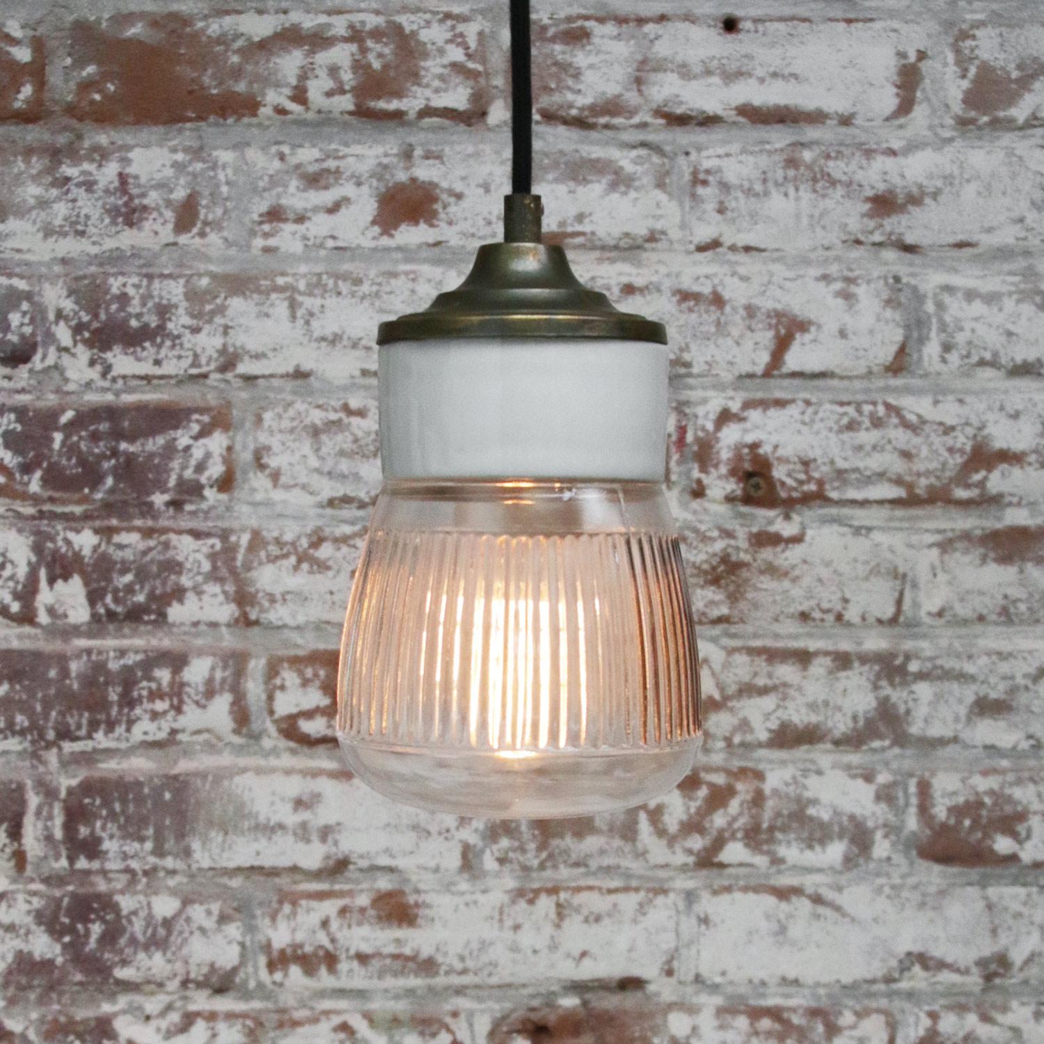 Porcelain industrial hanging lamp.
White porcelain, brass and clear striped glass.
2 conductors, no ground.

Weight: 1.20 kg / 2.6 lb

Priced per individual item. All lamps have been made suitable by international standards for incandescent