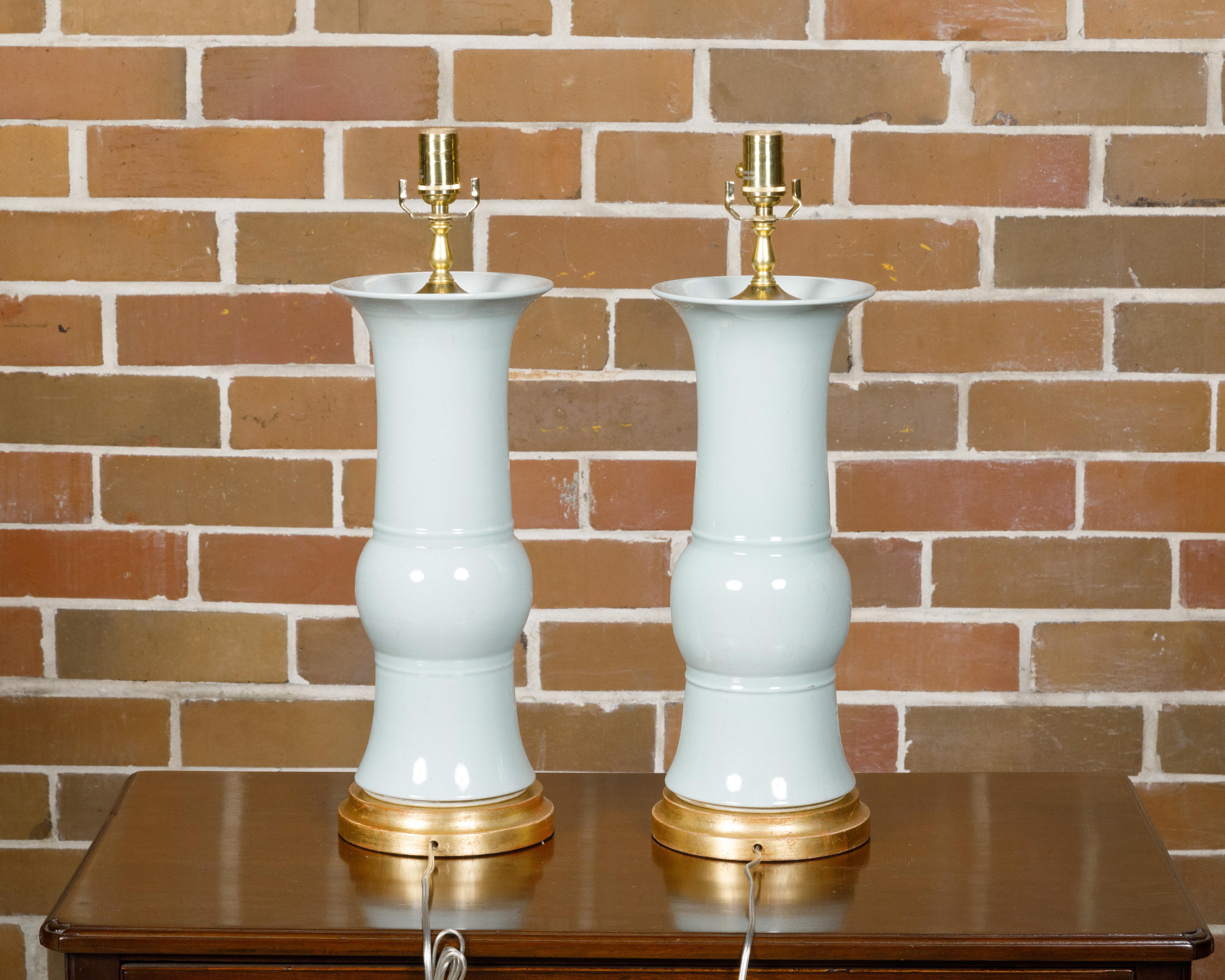 Glazed White Porcelain Table Lamps on Custom Giltwood Bases, a Pair Wired for the USA For Sale
