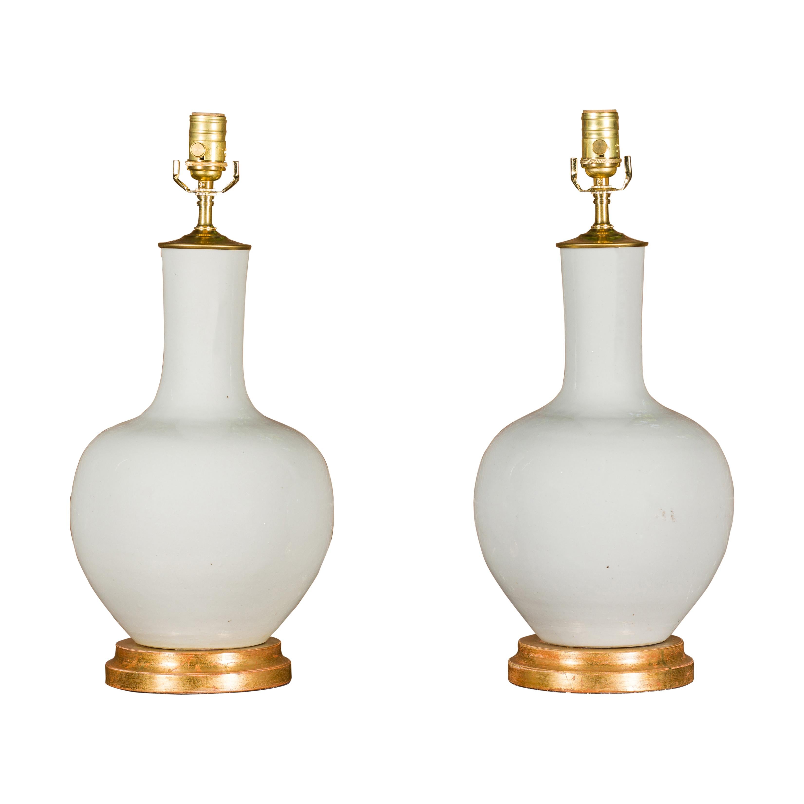 White Porcelain Vases Made into Wired Table Lamps on Giltwood Bases, a Pair 9