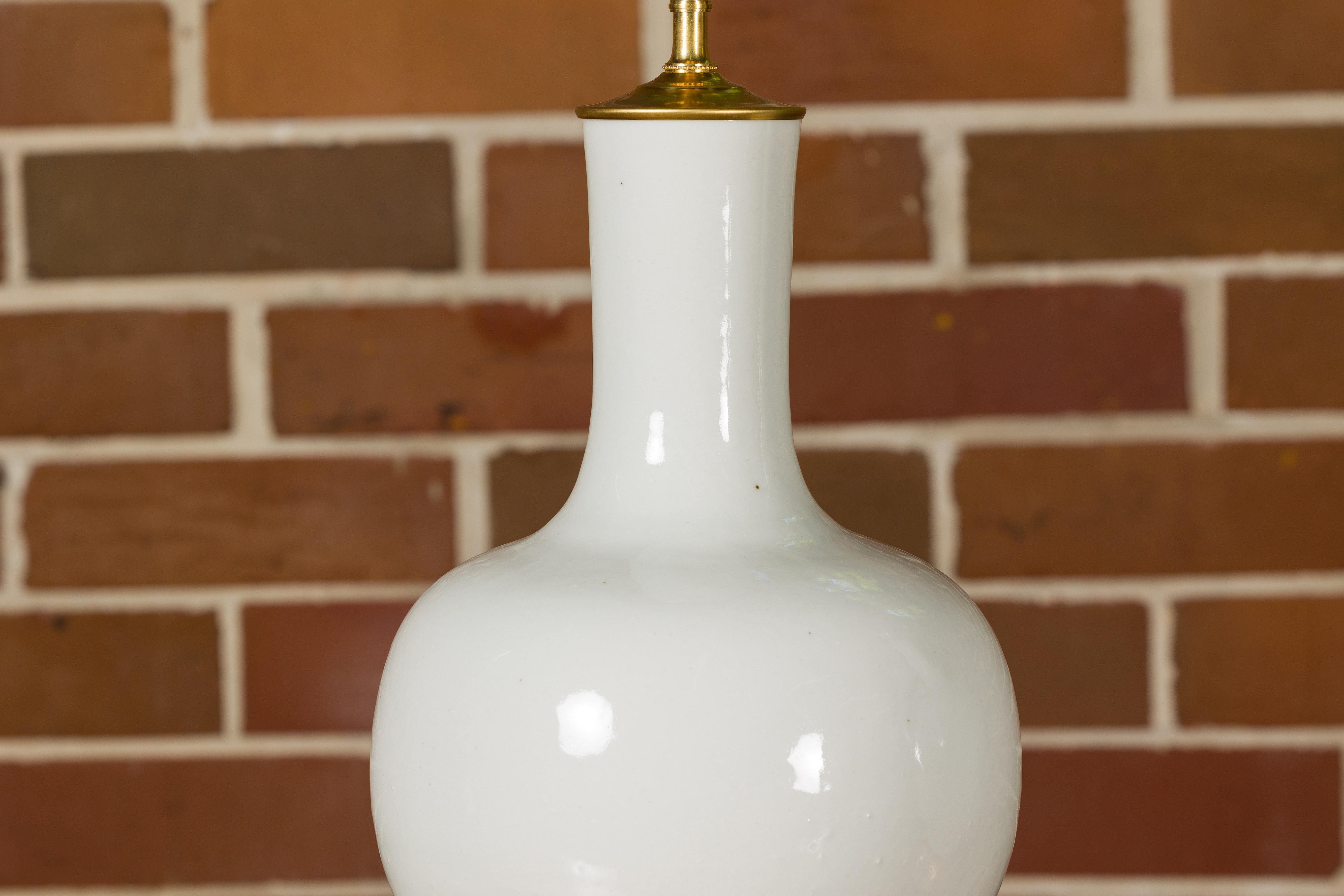 White Porcelain Vases Made into Wired Table Lamps on Giltwood Bases, a Pair 3