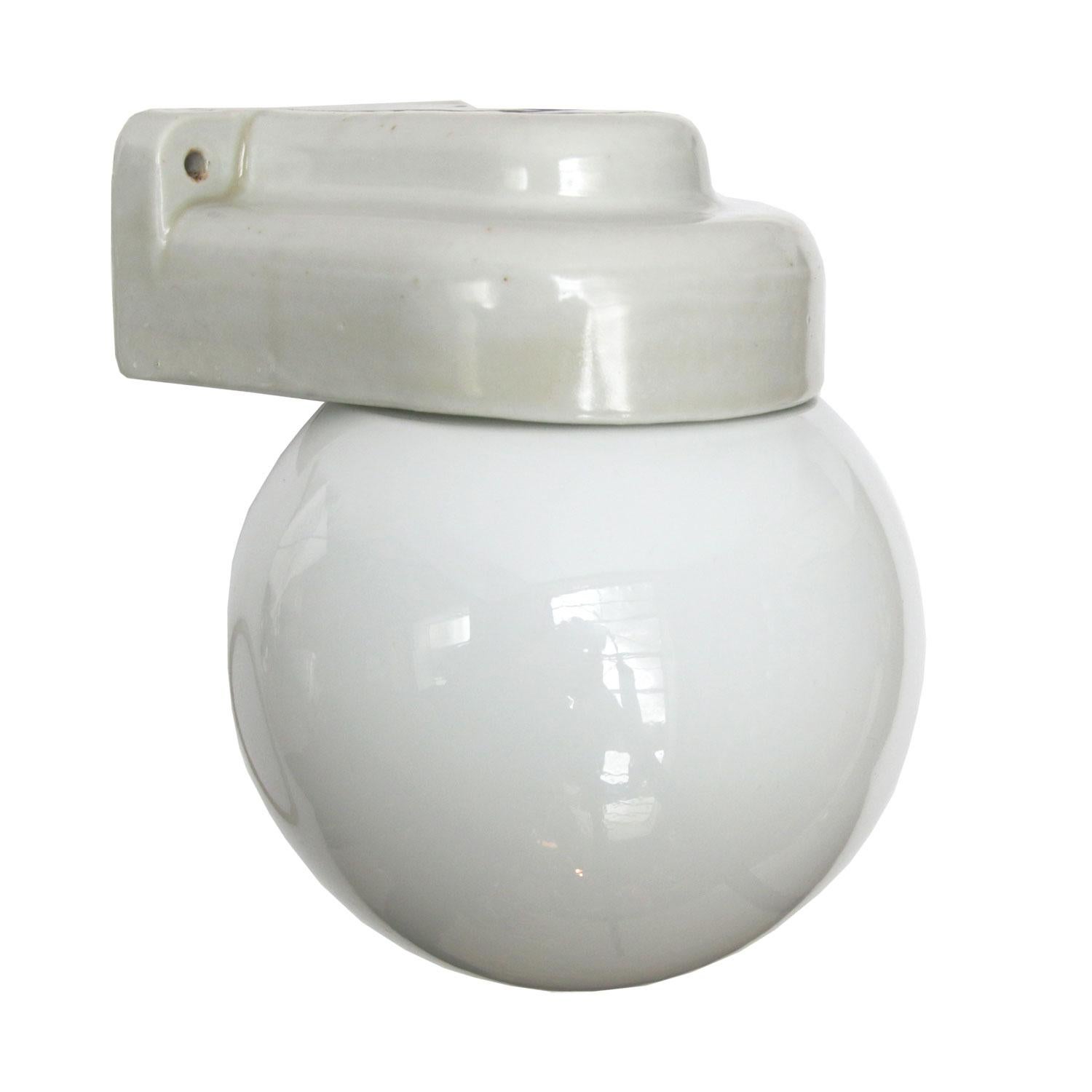 Industrial wall lamp or scone. White porcelain. White opaline glass.
Two conductors. No ground.
Suitable for 110 volt USA

Weight: 1.5 kg / 3.3 lb

Priced per individual item. All lamps have been made suitable by international standards for