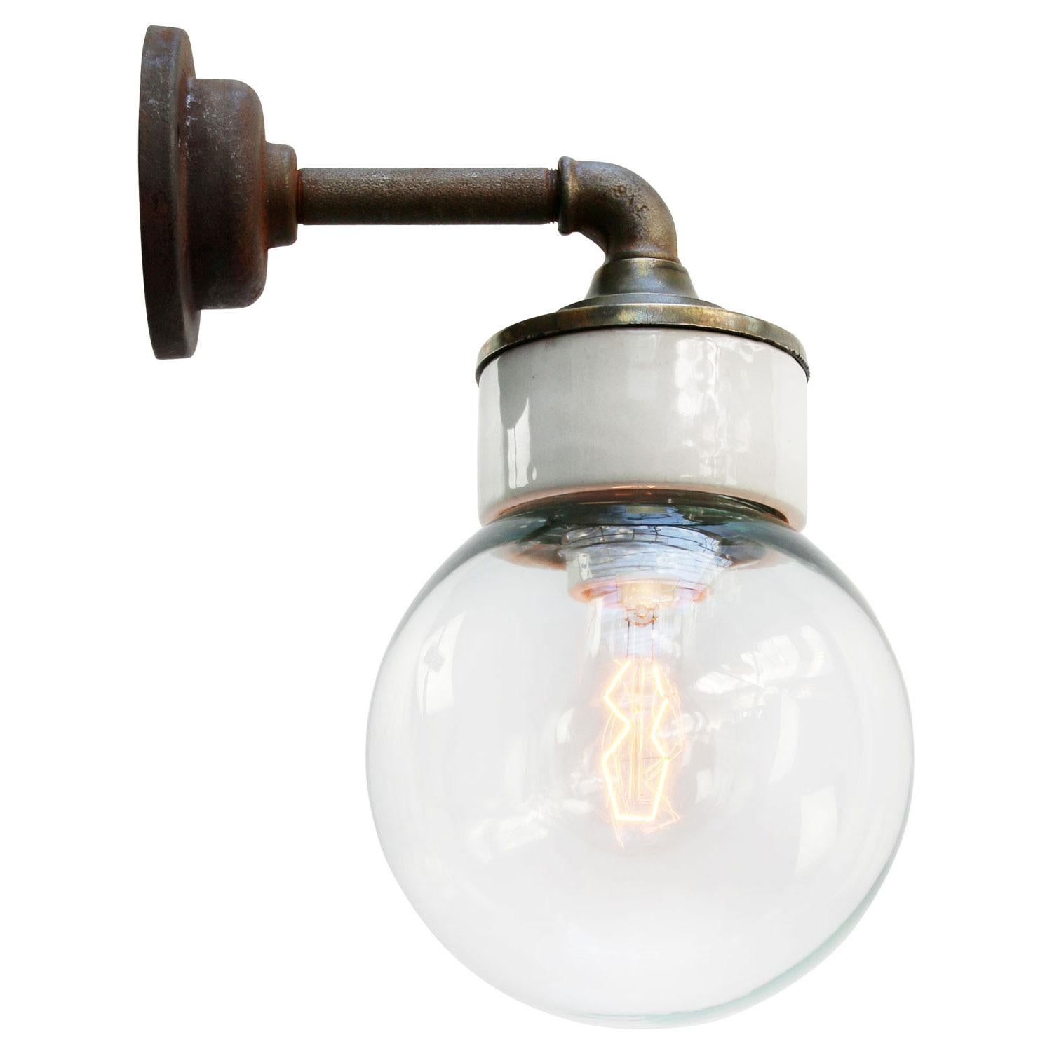 Porcelain Industrial wall lamp.
White porcelain, brass and cast iron
Clear glass.
2 conductors, no ground.

Diameter wall mount 10.5 cm / 4”

for use inside only

Measures: Weight: 2.05 kg / 4.5 lb

Priced per individual item. All lamps have been