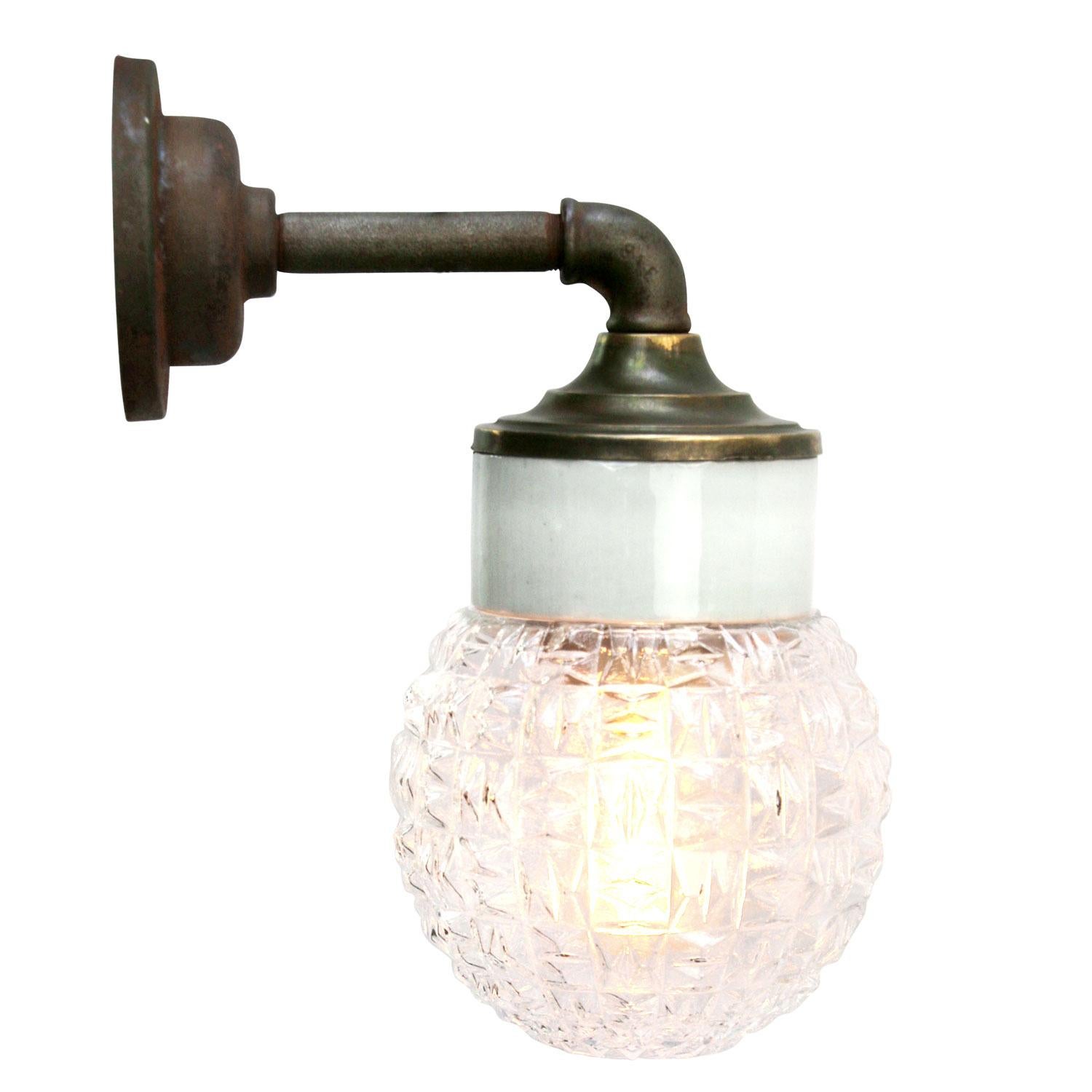 Porcelain industrial wall lamp.
White porcelain, cast iron, brass and clear glass.
2 conductors, no ground.

Diameter wall mount 10.5 cm / 4”

for use inside only

Measures: Weight: 2.05 kg / 4.5 lb

Priced per individual item. All lamps have been