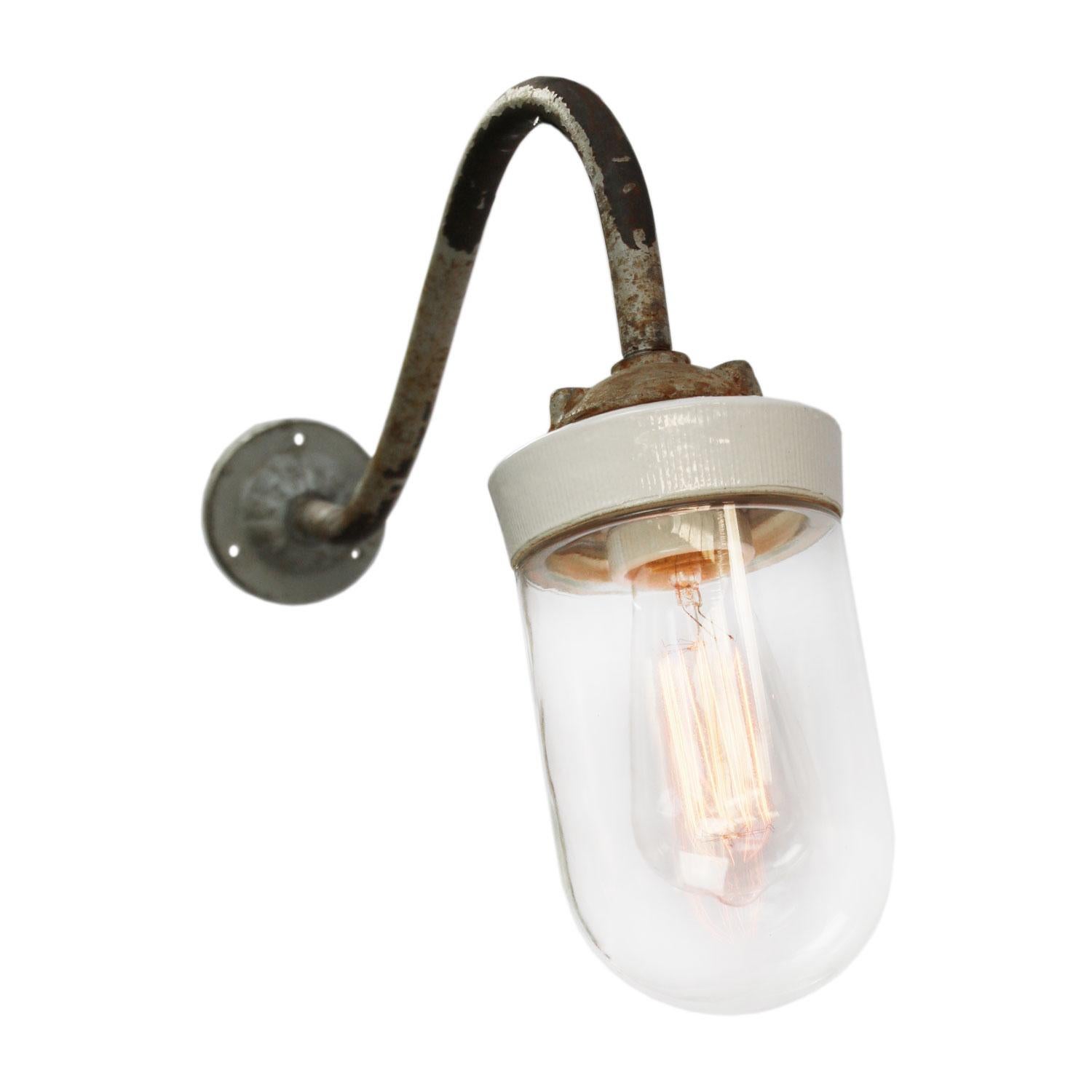 Industrial wall light.
Cast iron and porcelain top, clear glass.
Diameter cast iron wall mount: 9 cm, 3 holes to secure.

Weight: 2.00 kg / 4.4 lb

Priced per individual item. All lamps have been made suitable by international standards for