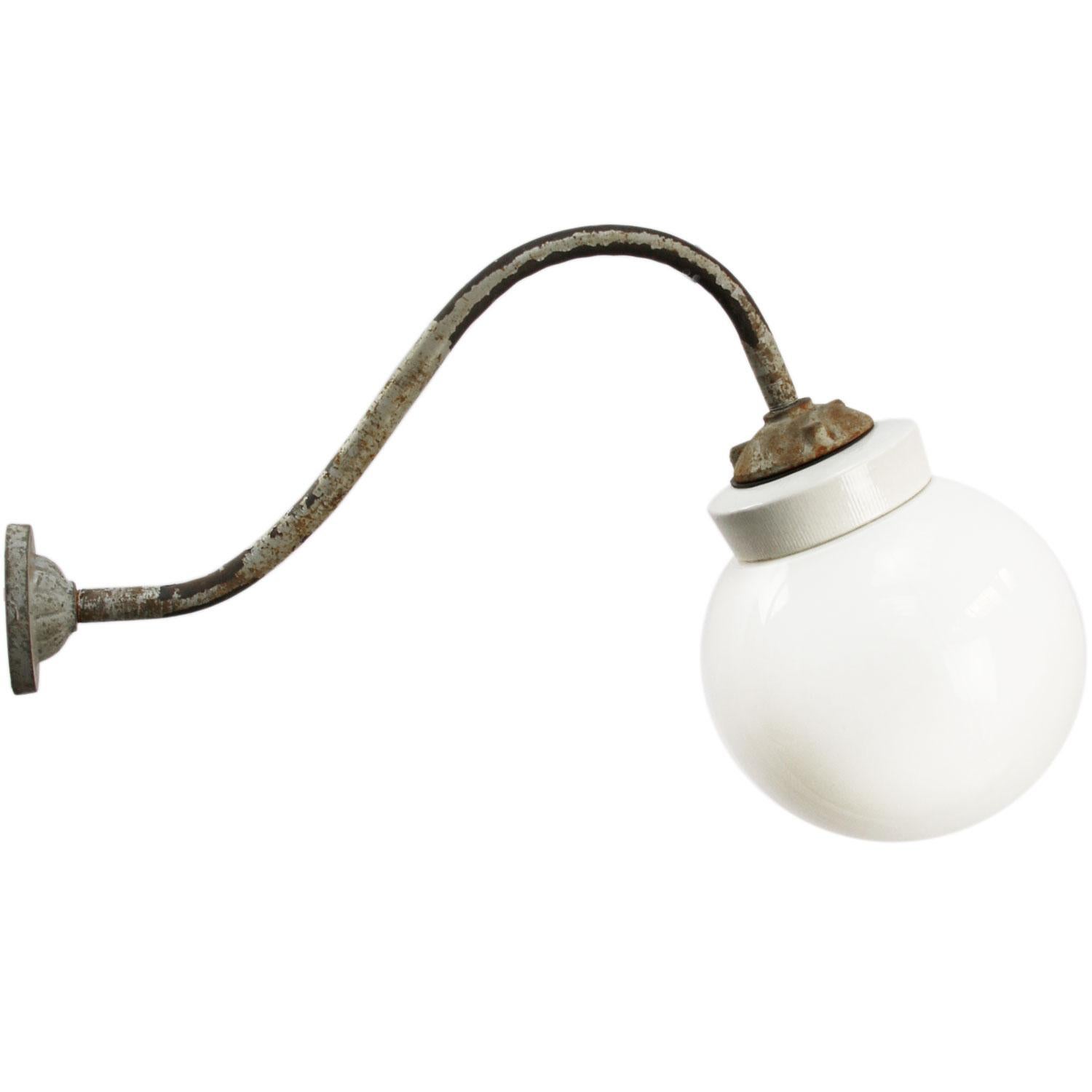 Industrial wall light .
Cast iron and porcelain top, white opaline glass.
Diameter cast iron wall mount: 9 cm, 3 holes to secure.

Weight: 2.00 kg / 4.4 lb

Priced per individual item. All lamps have been made suitable by international standards for