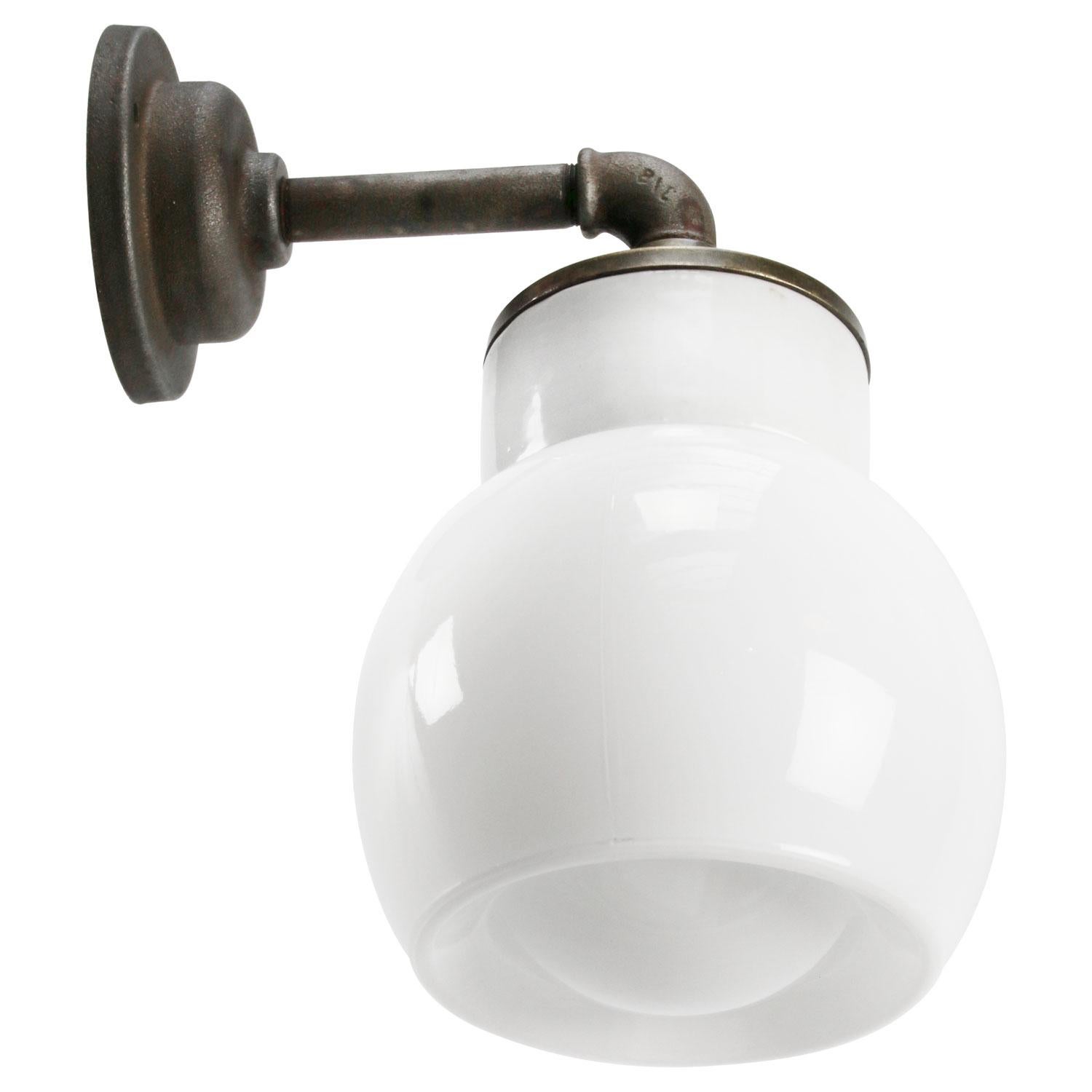 Porcelain industrial wall lamp.
White porcelain, cast iron, brass and Opaline milk glass.
2 conductors, no ground.

Diameter wall mount 10.5 cm / 4”

for use inside only

Measures: Weight: 2.05 kg / 4.5 lb

Priced per individual item. All lamps have
