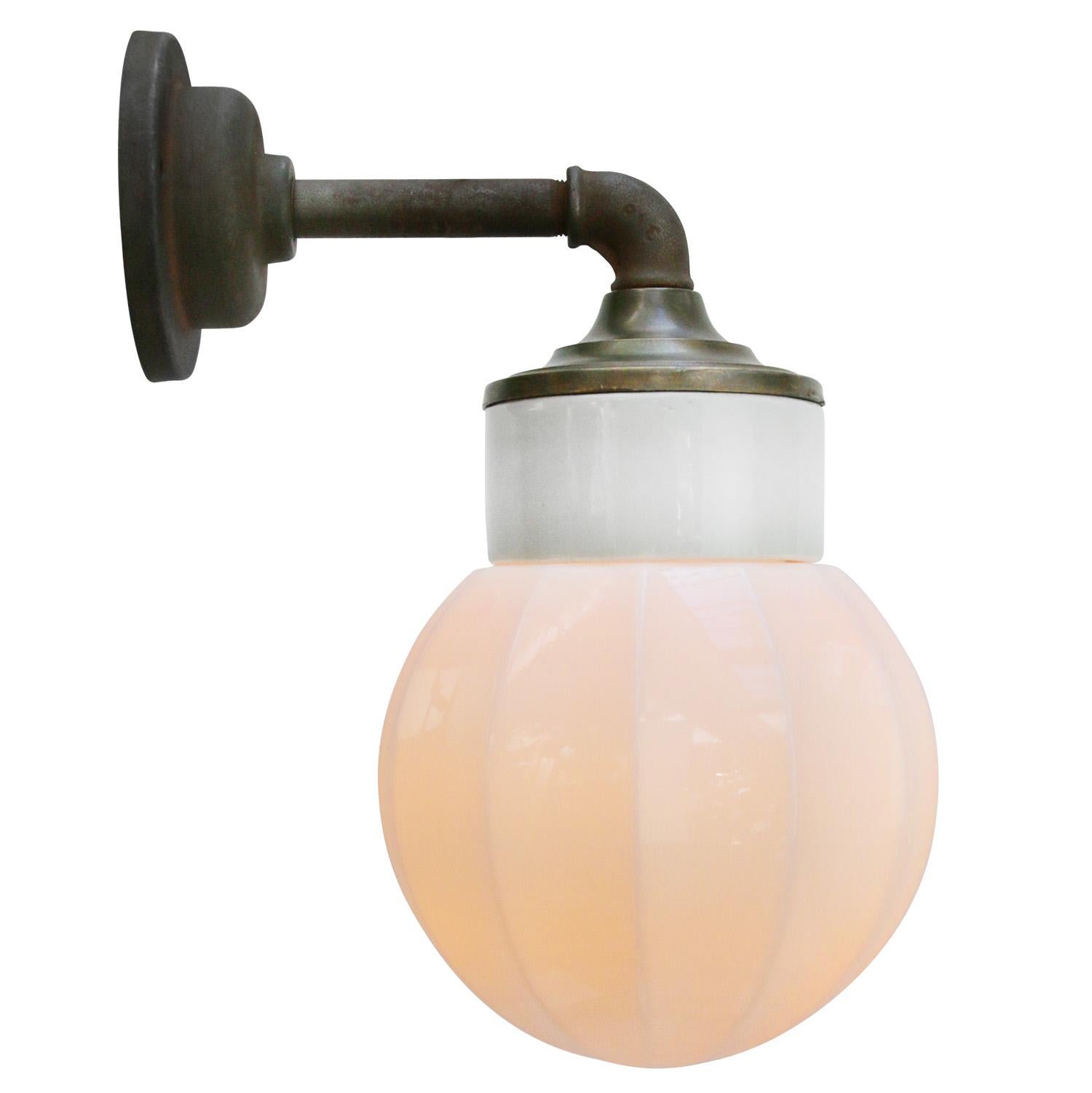 Porcelain industrial wall lamp.
White porcelain, cast iron, brass and Opaline milk glass.
2 conductors, no ground.

For use inside only

Measures: Weight: 2.10 kg / 4.6 lb

Priced per individual item. All lamps have been made suitable by