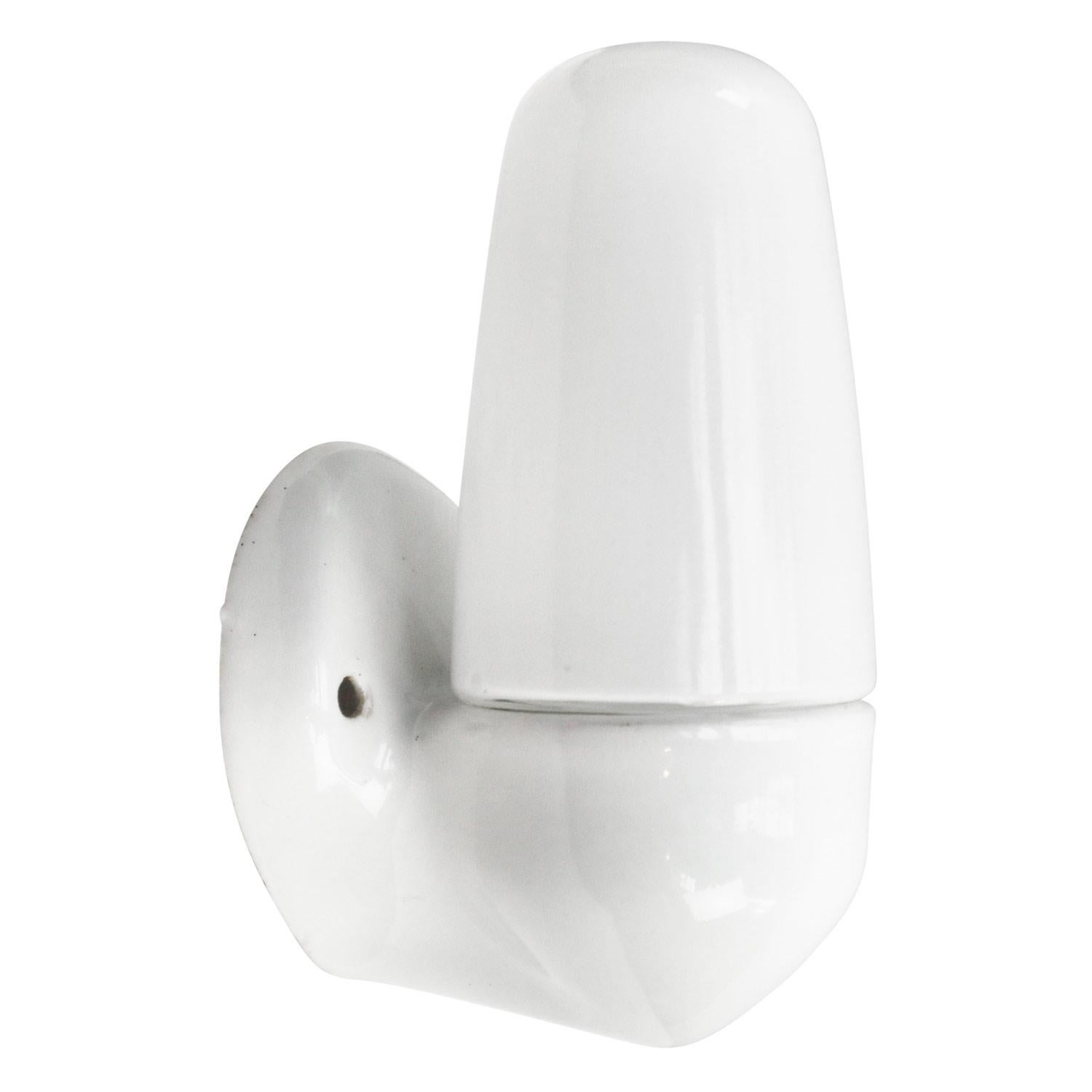 Porcelain wall lamp / scone by Lindner no. 6067
Designed by Wilhelm Wagenfeld
White porcelain, white opaline glass.
2 conductors, no ground.

Weight: 0.40 kg / 0.9 lb

E14 bulb holder. Priced per individual item. All lamps have been made