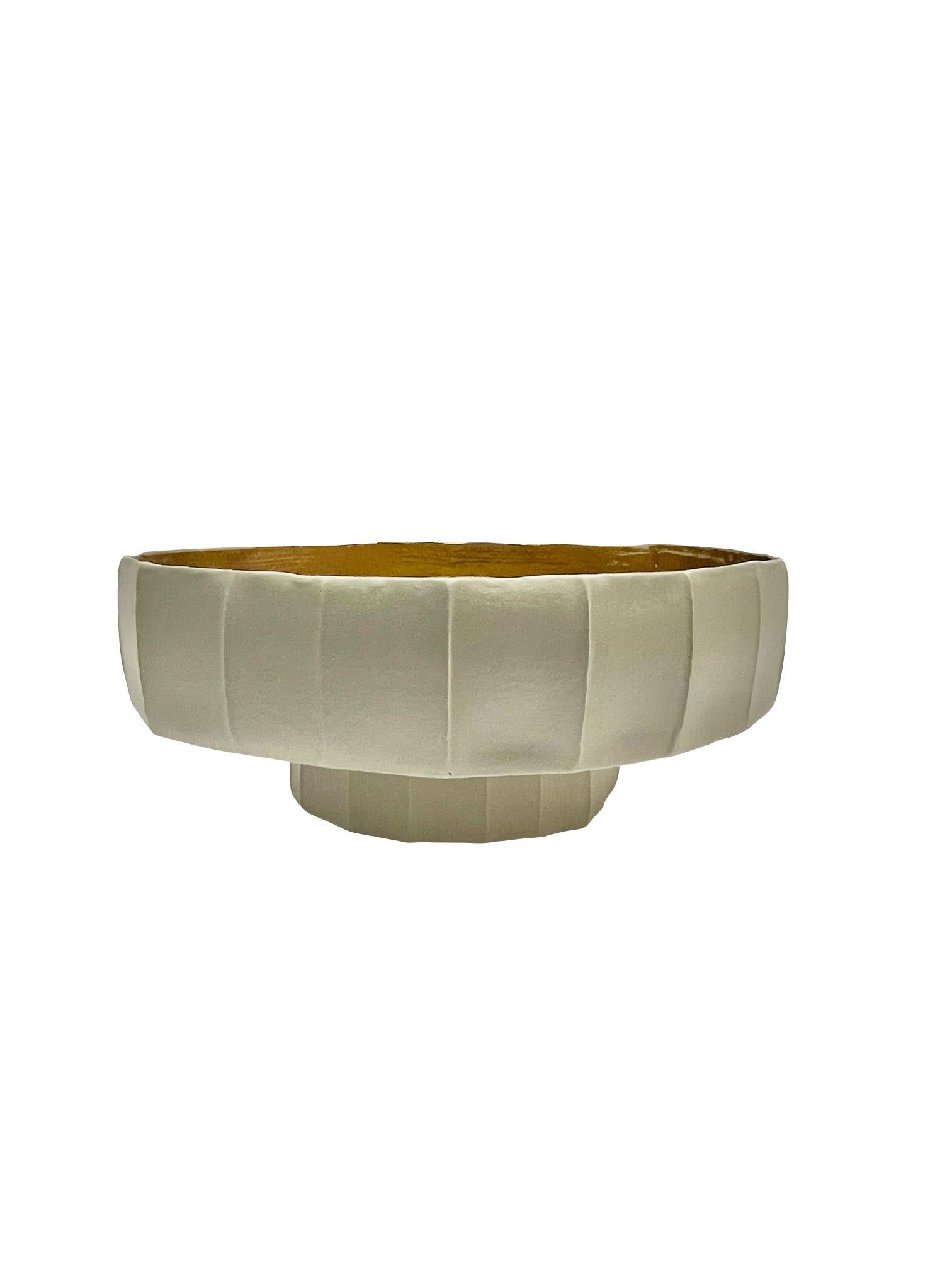 Italian white porcelain footed bowl with wide rib decorative design.
Smooth 22K gold interior.