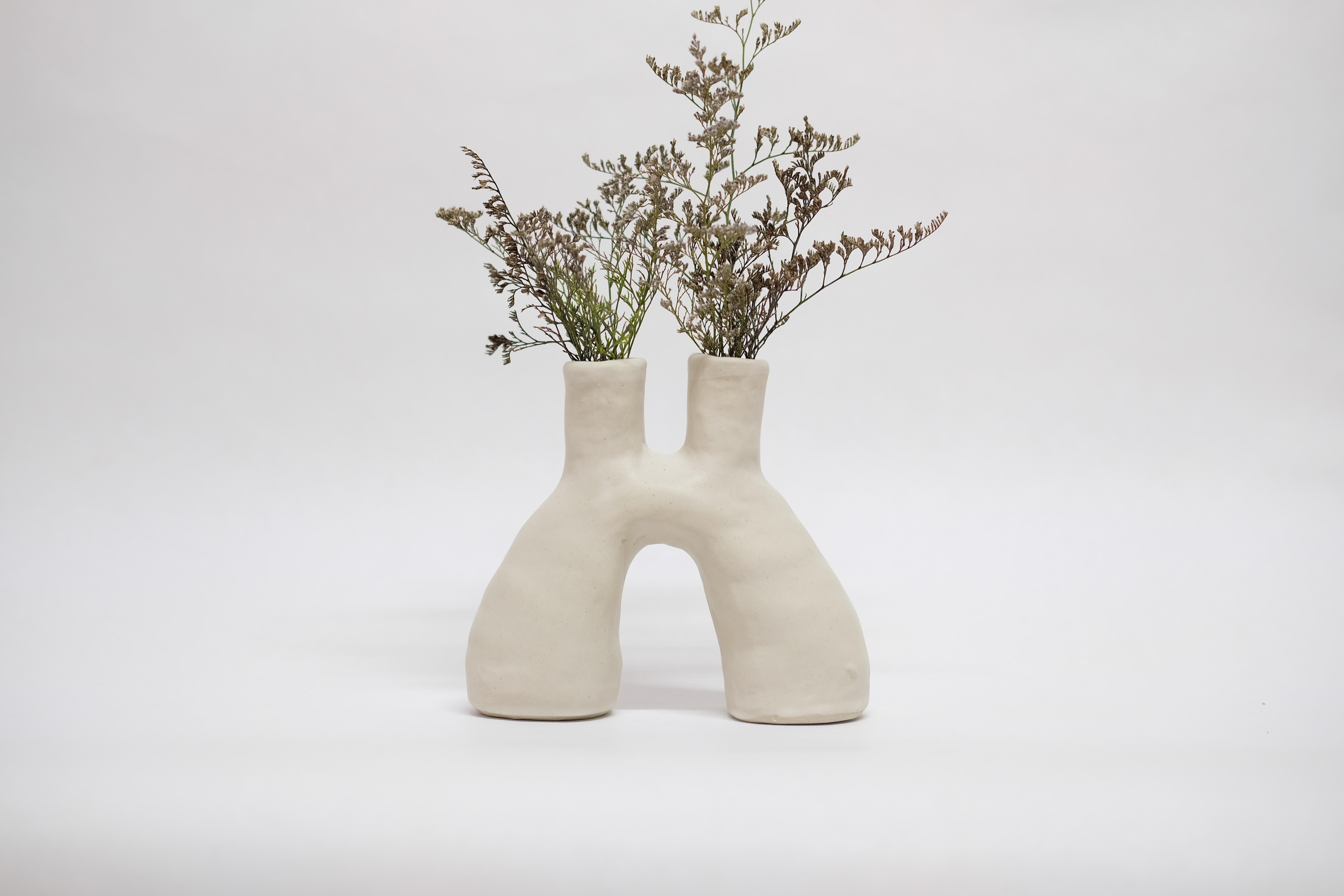 White portal stoneware vase by Camila Apaez
One of a kind
Materials: Stoneware
Dimensions: 7 x 17 x 14 cm
Options: White bone, butter milk, stone sage.

This year has been shaped by the topographies of our homes and the uncertainty of our