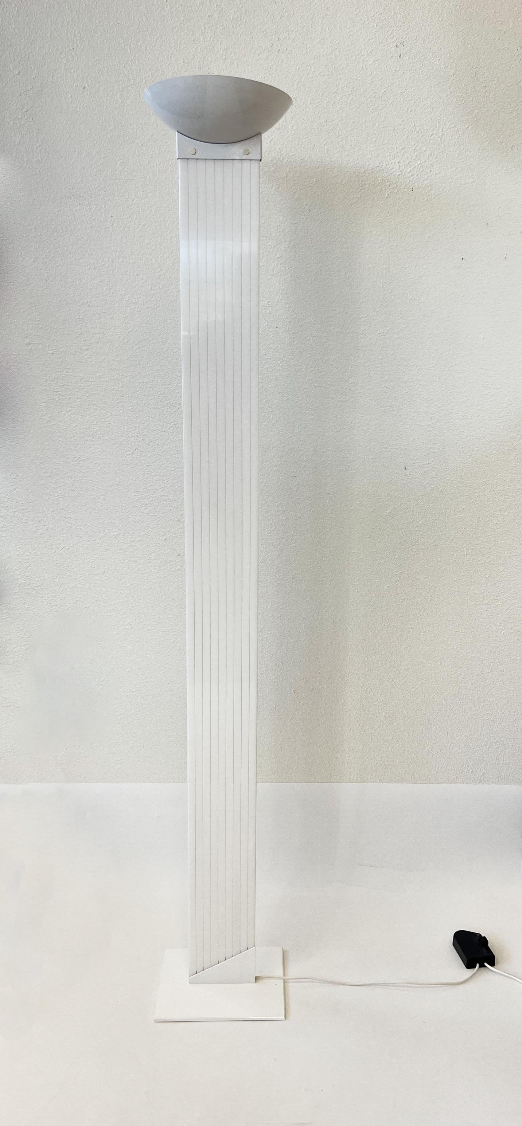 1980’s White Italian Post-Modern torchiere floor lamp by JD Aznar. 
In beautiful original condition. 
Wire for US. 
It takes 150max halogen bulb. 
